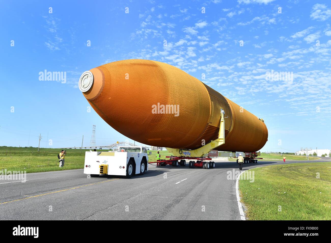 New Orleans, Louisiana, USA. 12th April, 2016. The last Space Shuttle external fuel tank begins a long journey to the California Science Center as it is moved to a barge at the Michoud Assembly Facility April 12, 2016 in New Orleans, Louisiana. The massive 154 feet long, 69,000 pound structure once fed liquid oxygen and liquid hydrogen to the space shuttle main engines and has been retired with the Shuttle program. Credit:  Planetpix/Alamy Live News Stock Photo