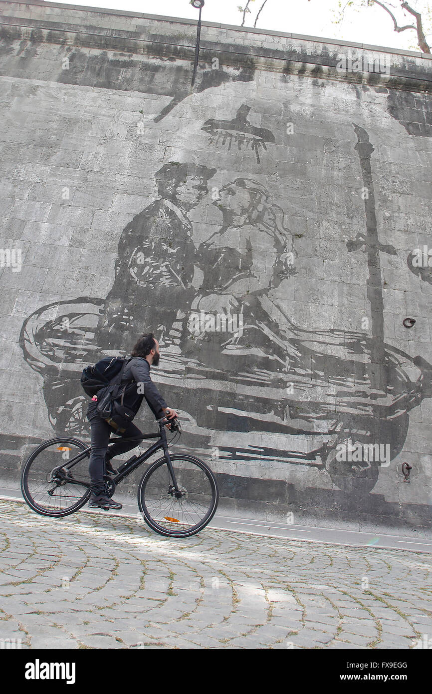 Marcello Mastroianni and Anita Ekberg in 'La dolce vita'. Rome 12th April 2016. The longest series of murals in Rome was just ended along the river Tiber by the South African artist William Kentridge, titled 'Triumphs and Laments'. The artist used a very simple, ecologic technique to realize the paintings: he 'cleaned' the layer of smog covering the walls along the river with vapor. The mural, 550mt long and made of 80 figures 10mt tall, tells the story, made of Triumphs and Laments, of Rome. Stock Photo