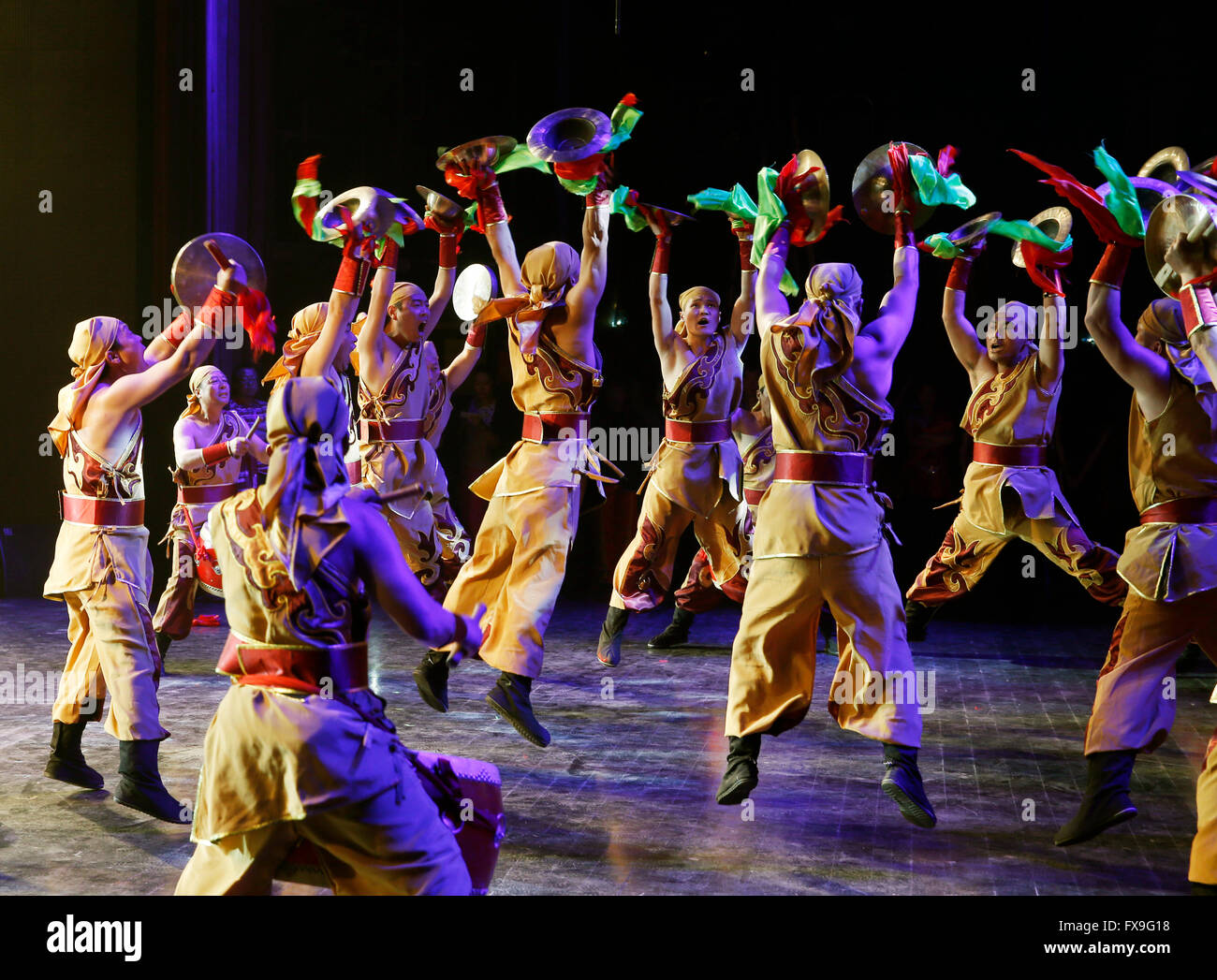 Taiyuan, China's Shanxi Province. 13th Apr, 2016. Actors from an art troupe of Shaanxi's Hancheng City perform during a drum and gong tournament in Taiyuan, north China's Shanxi Province, April 13, 2016. Twelve drum troupes across the country participated in the contest here on Wednesday. Credit:  Yan Yan/Xinhua/Alamy Live News Stock Photo