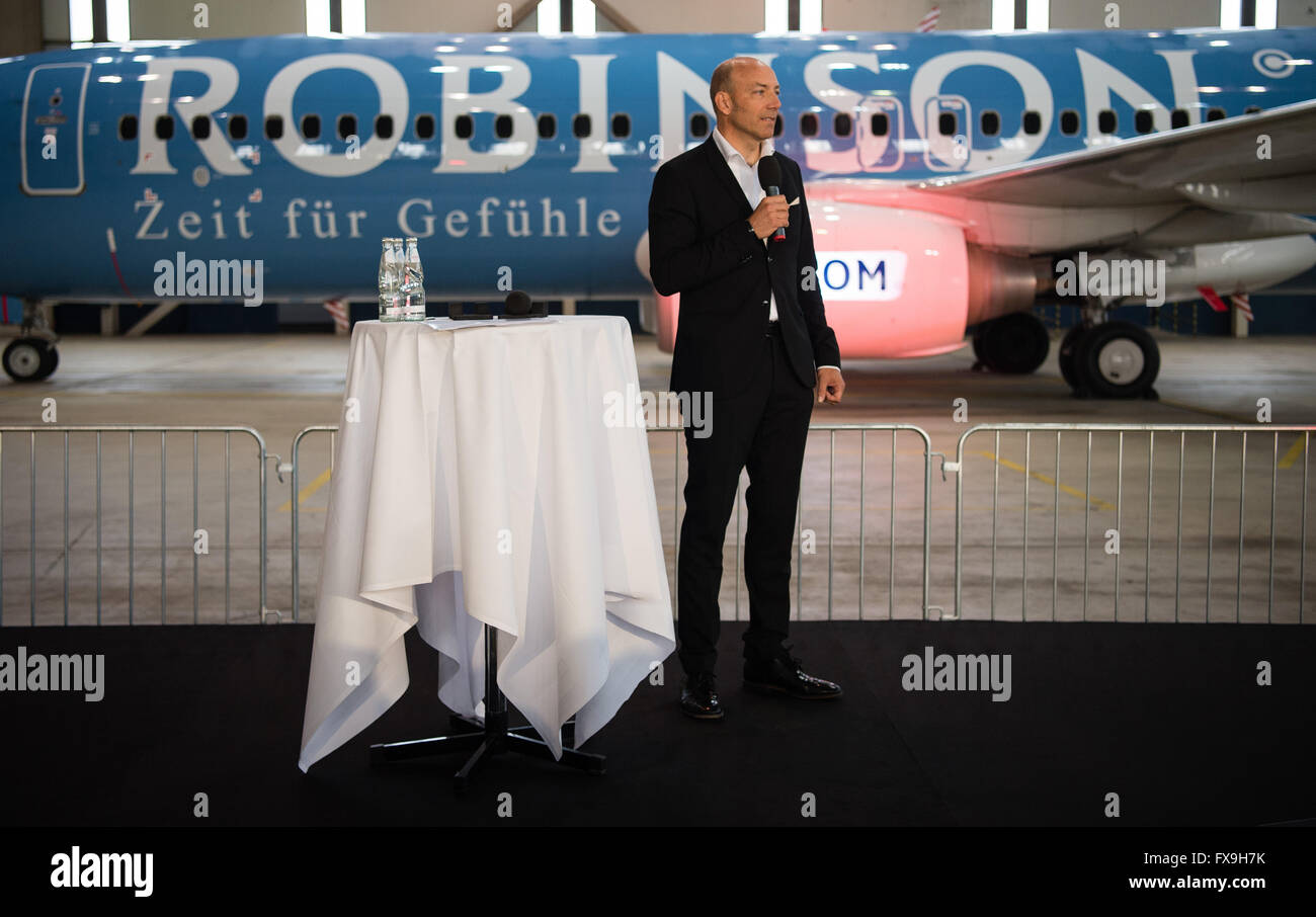 The CEO of Robinson Club, Ingo Burmester, stands infront of  an aircraft of the type  Boeing 737-800 of carrier TUI, with the writing 'Robinson' on it, stands during a ceremonial aircraft launching   in the hangar at the airport in Hanover, Germany, 13 April 2016. Travel agent and airline TUI as launched two aircraft named as 'Tui Magic Life' and 'Robinson'. TUI has launched a marketing initiative to present its fleet of aircraft as branding ambassadors, advertising TUIs own brand of hotels. PHOTO: SEBASTIAN GOLLNOW/dpa Stock Photo