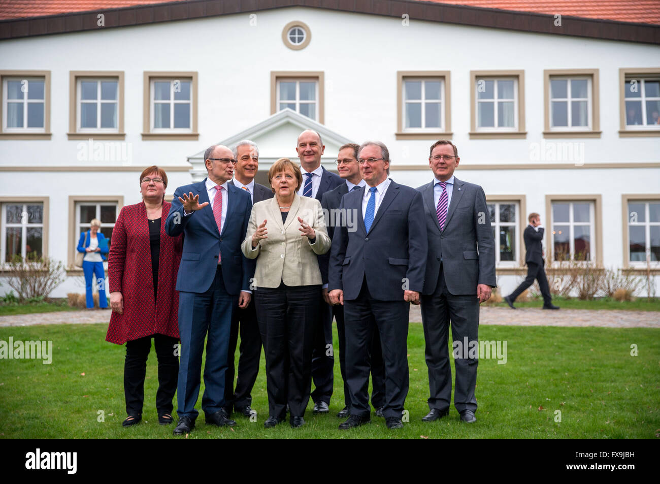 German Chancellor Angela Merkel (CDU, C) meets the premiers of the German states in eastern Germany Erwin Sellering (Mecklenburg-Western Pomerania, SPD, 2nd L), Dietmar Woidke (Brandenburg, SPD, 4th R.), Michael Mueller (Berlin, SPD, 3rd R), Reiner Haseloff (Saxony-Anhalt, CDU, 2nd R), Stanislaw Tillich (Saxony, CDU, §rd L), Bodo Ramelow (Thuringia, Die Linke, r) the government commissioner, Parliamentary State Secretary Iris Gleicke (SPD, l) at the conference hall at Stolpe manor near Anklam, Germany, 13 April 2016. The premiers are meeting for the 43rd conference of German states in eastern Stock Photo