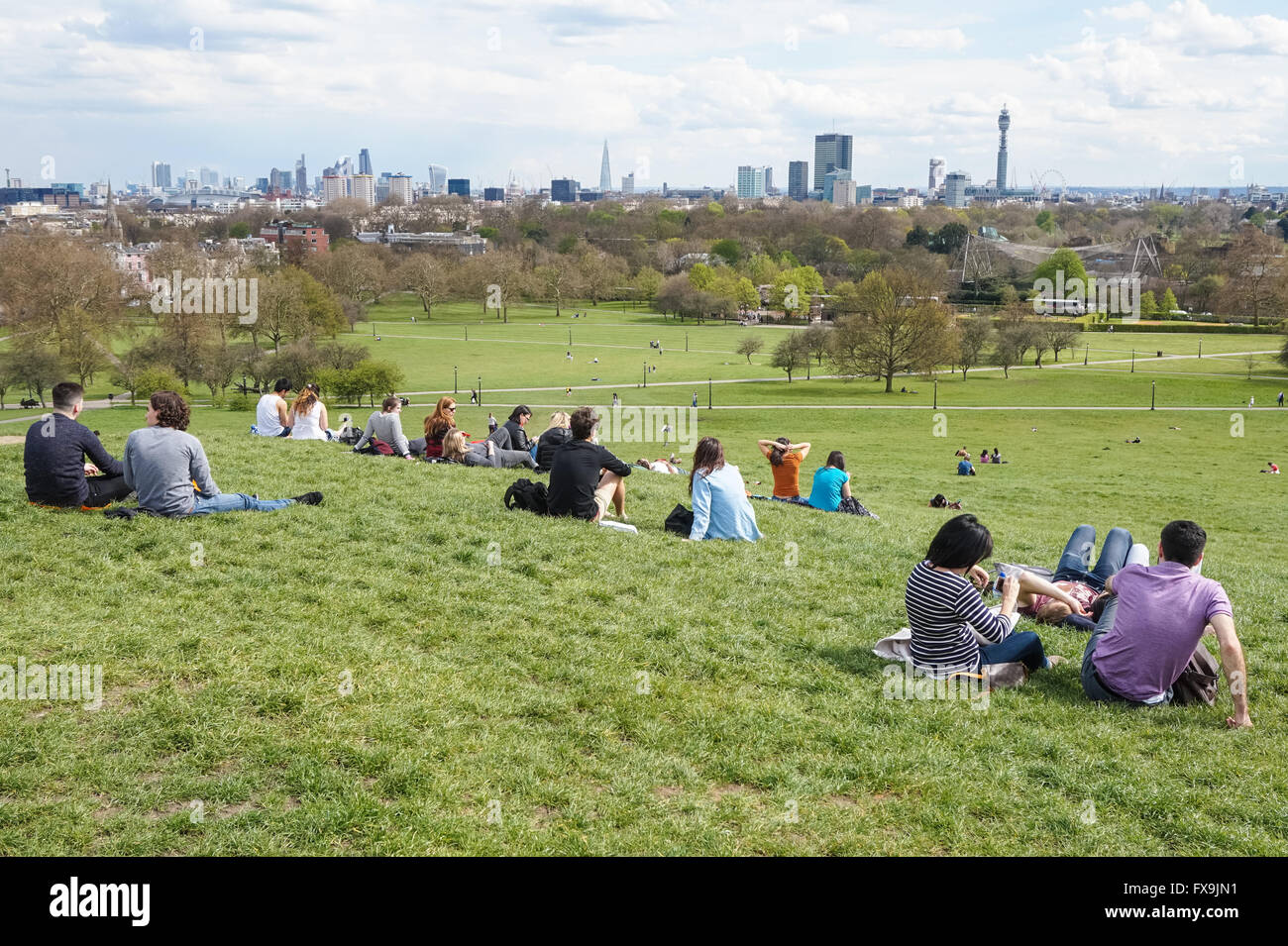 People enjoying view of London skyline from Primrose Hill, London England United Kingdom UK Stock Photo