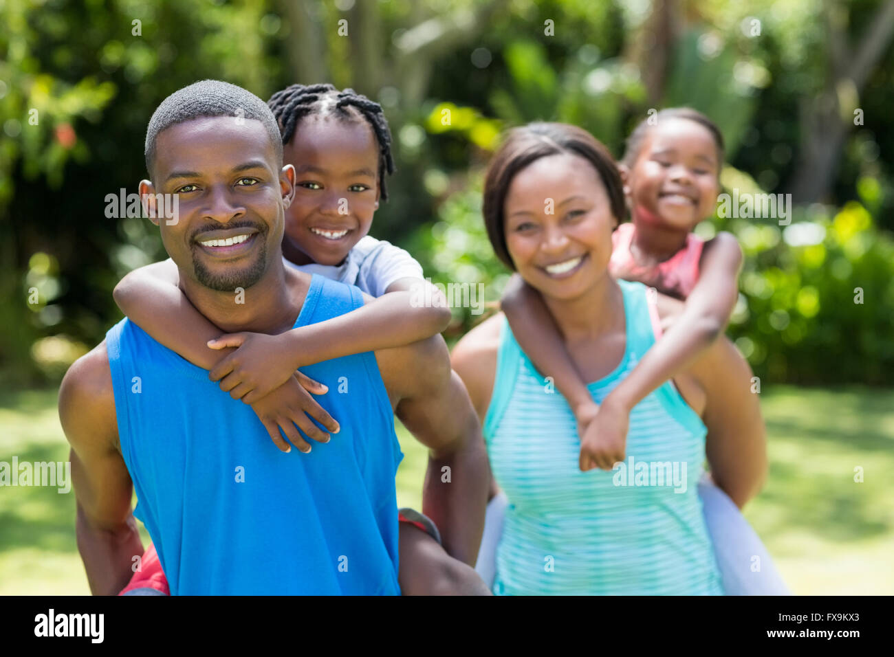 Happy family posing together Stock Photo - Alamy