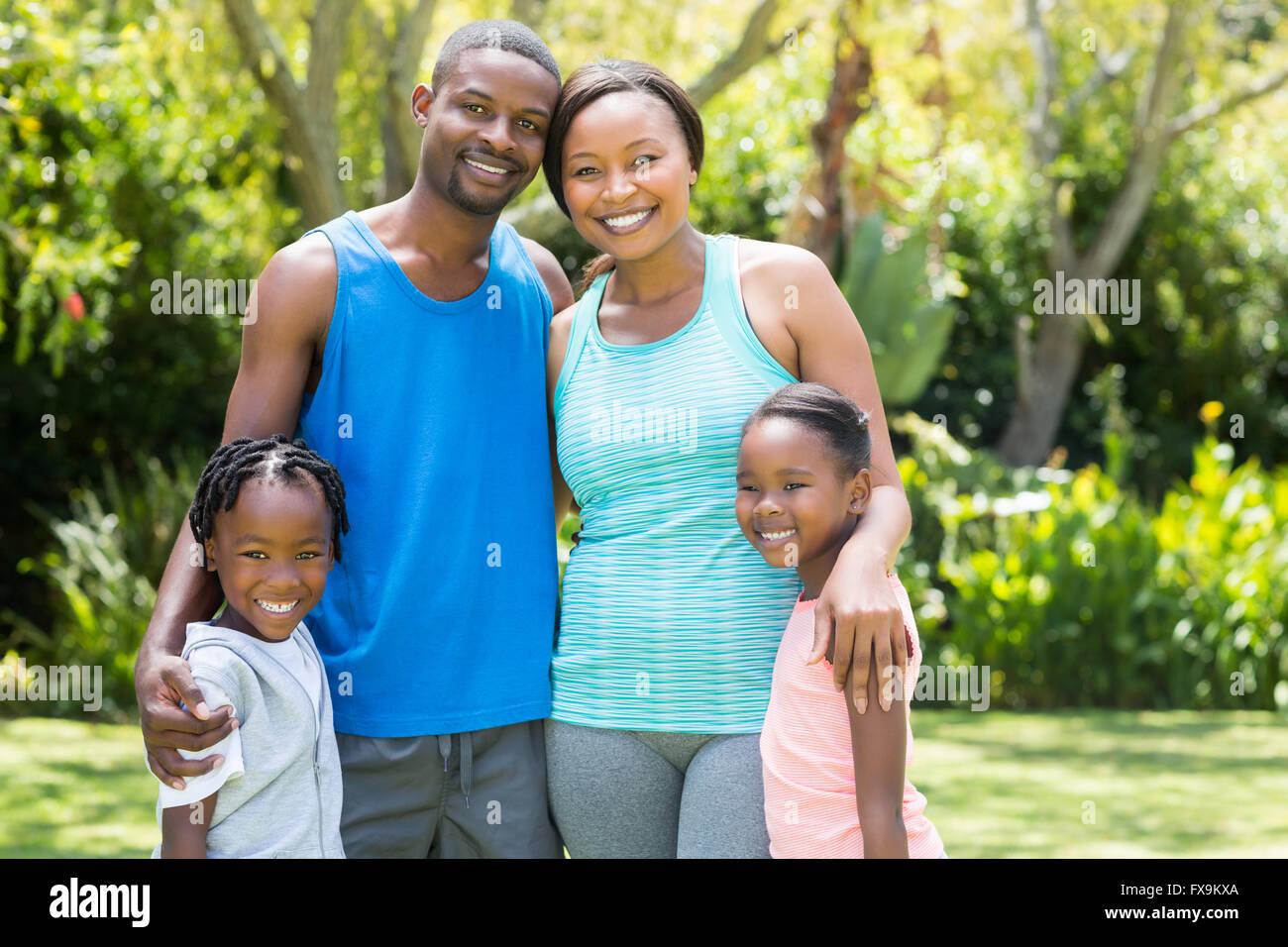 Happy family posing together Stock Photo - Alamy