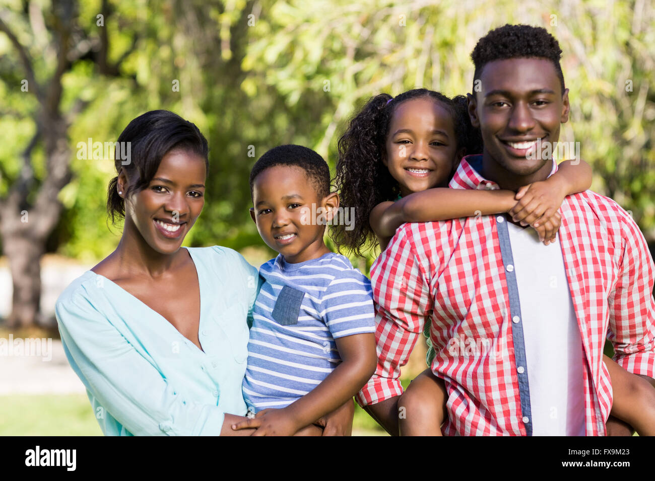 Happy family posing together Stock Photo - Alamy