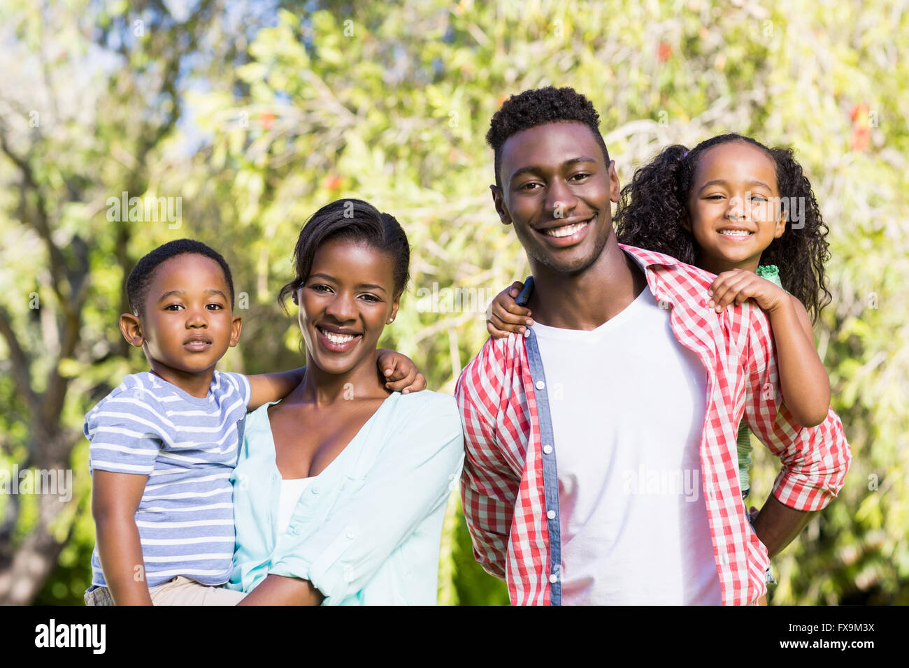 Happy family posing together Stock Photo - Alamy