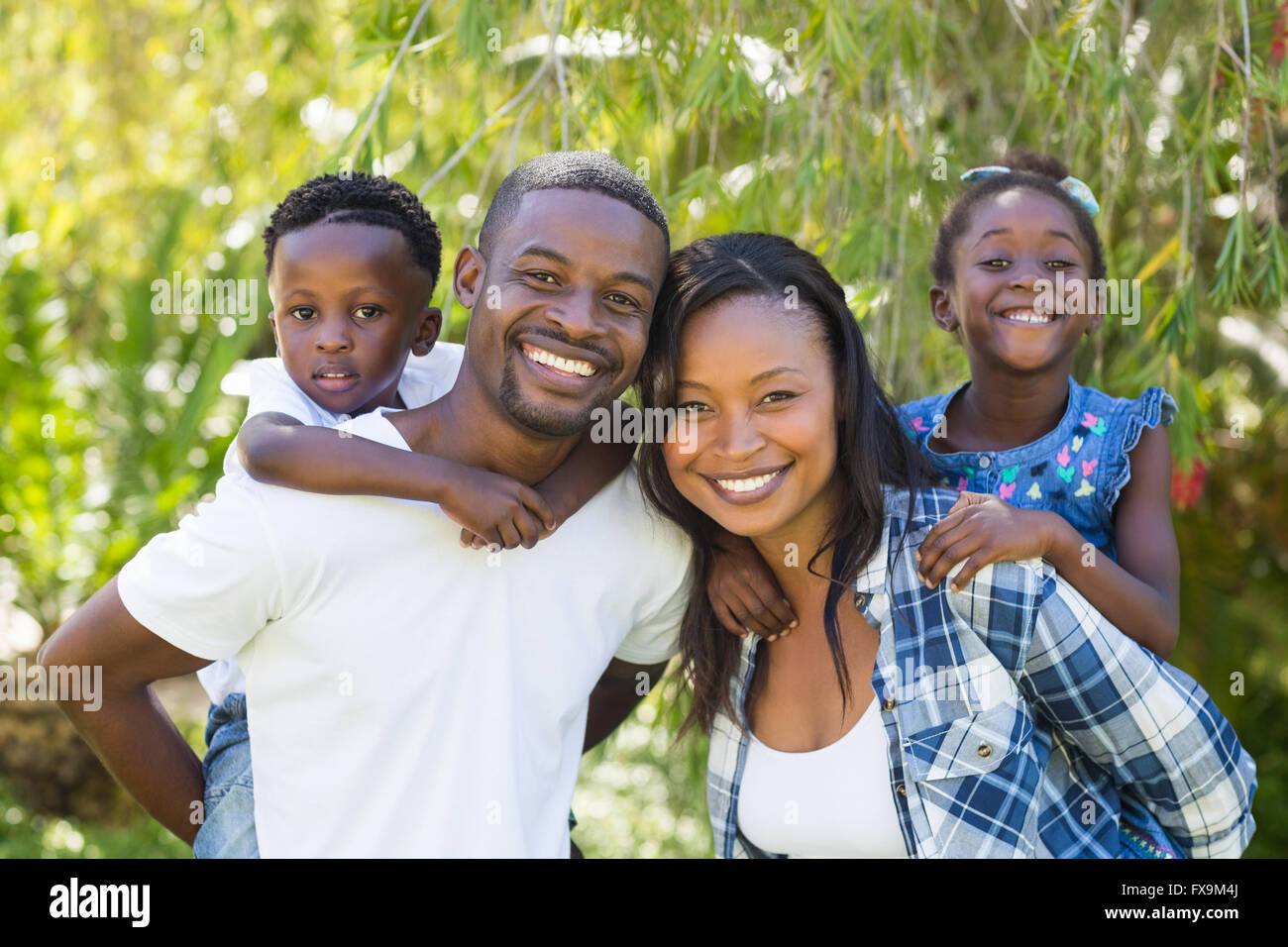 Happy family posing together Stock Photo - Alamy