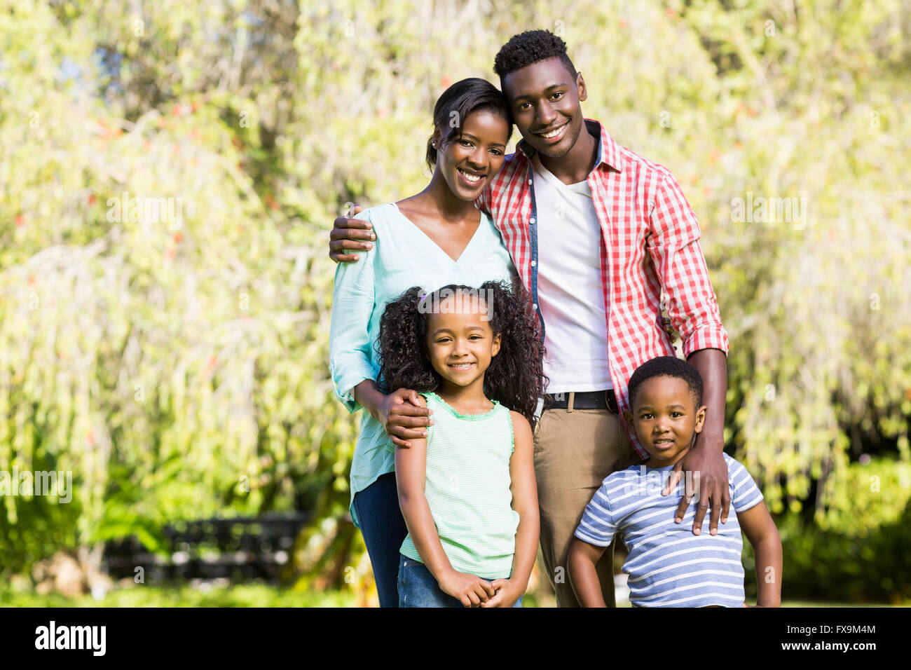Happy family posing together Stock Photo - Alamy