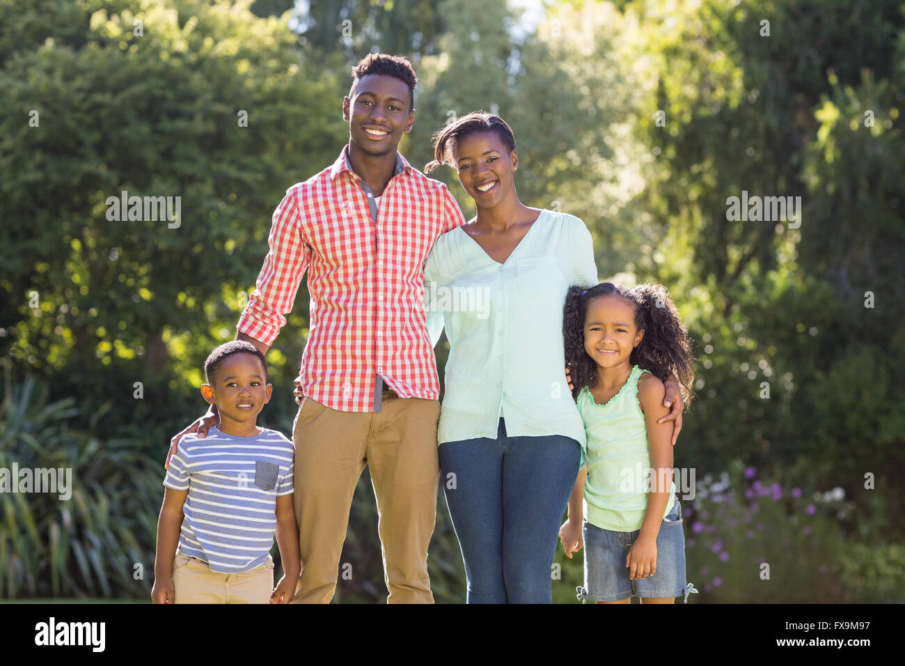 Happy family posing together Stock Photo - Alamy