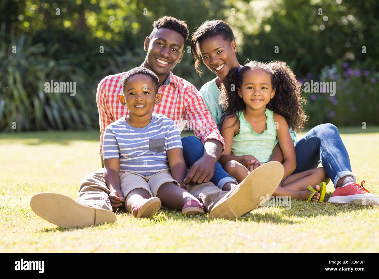 Happy family posing together Stock Photo - Alamy