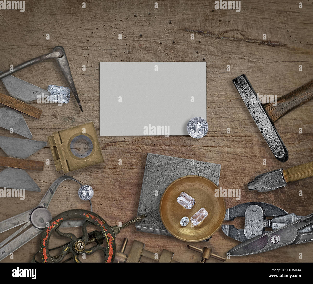 vintage jeweler tools and diamonds on a bench, space for text on