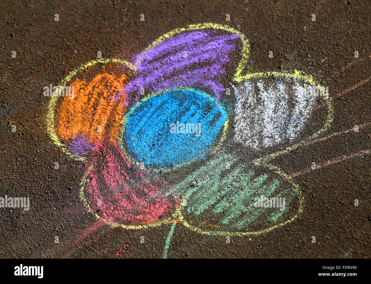 Beautiful child drawing on the road surface is photographed close up Stock Photo