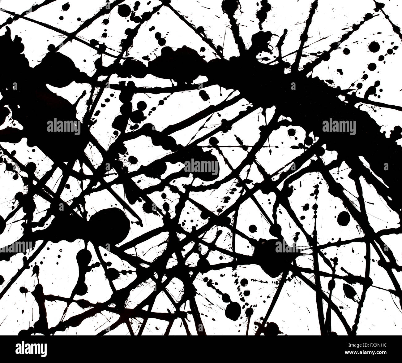 Abstract Black Paint Splatters Isolated on White Background. Stock Photo