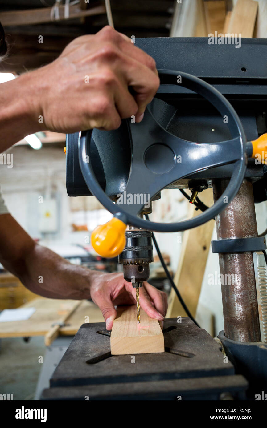 Carpenter using a drill Stock Photo Alamy