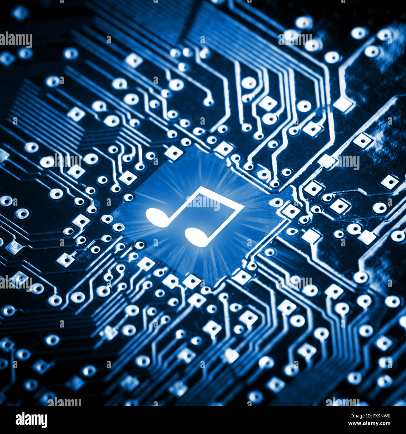 Music note on computer chip Stock Photo
