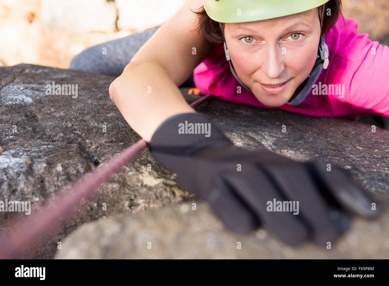 Woman rock climbing Stock Photo - Alamy
