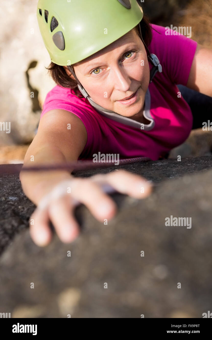 Woman rock climbing Stock Photo