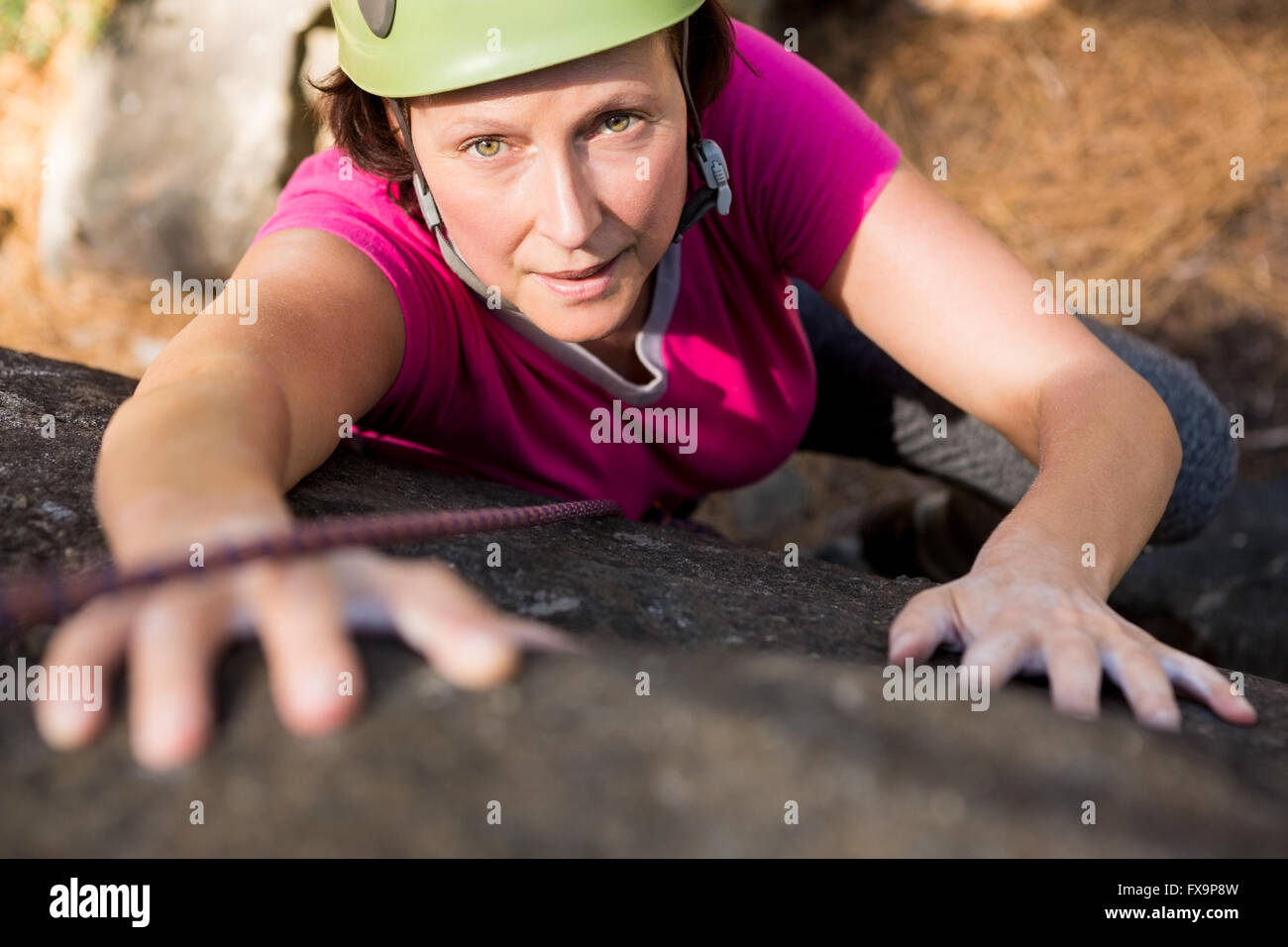 Woman rock climbing Stock Photo - Alamy