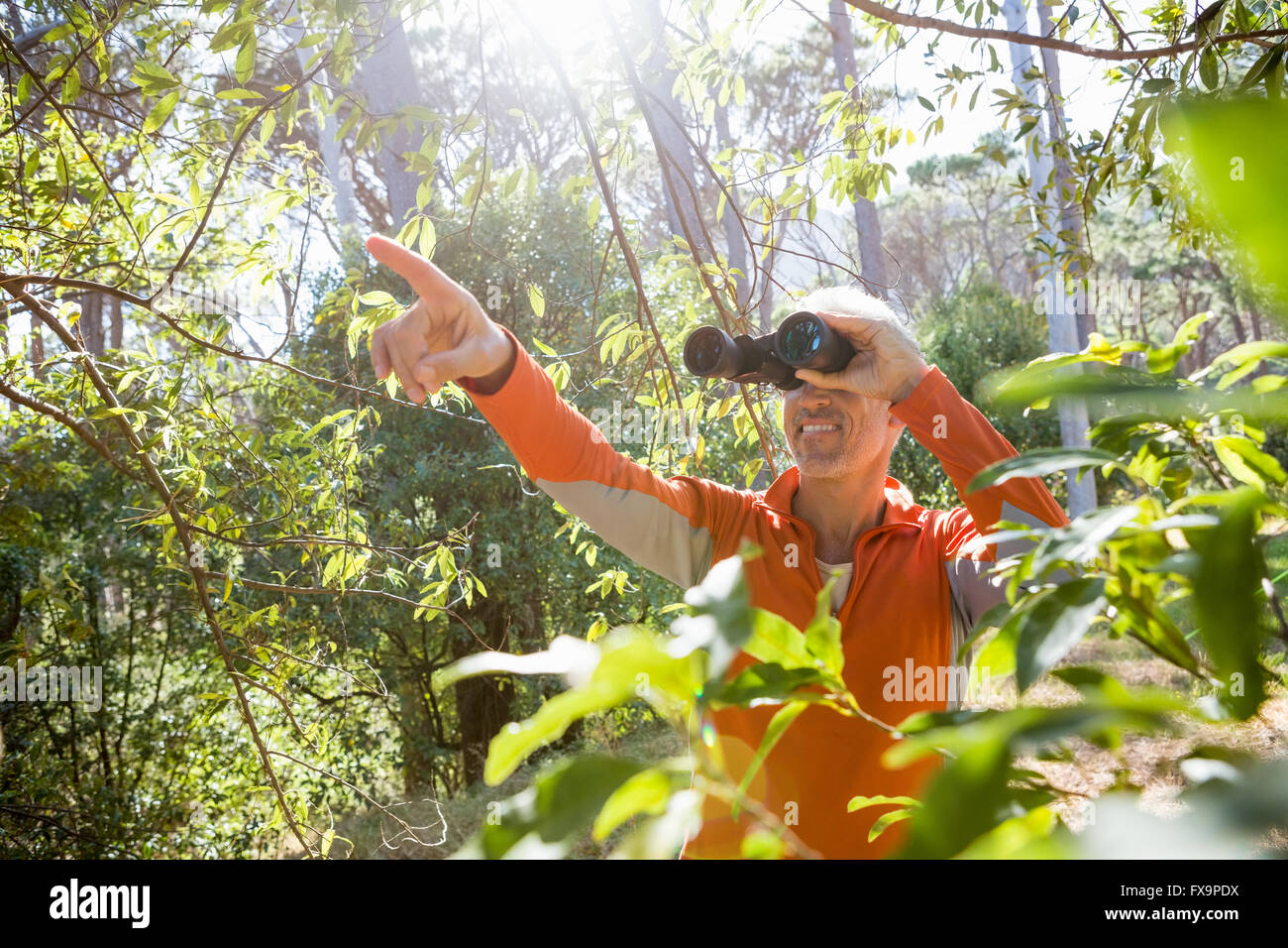 Mature man binoculars hi-res stock photography and images - Alamy