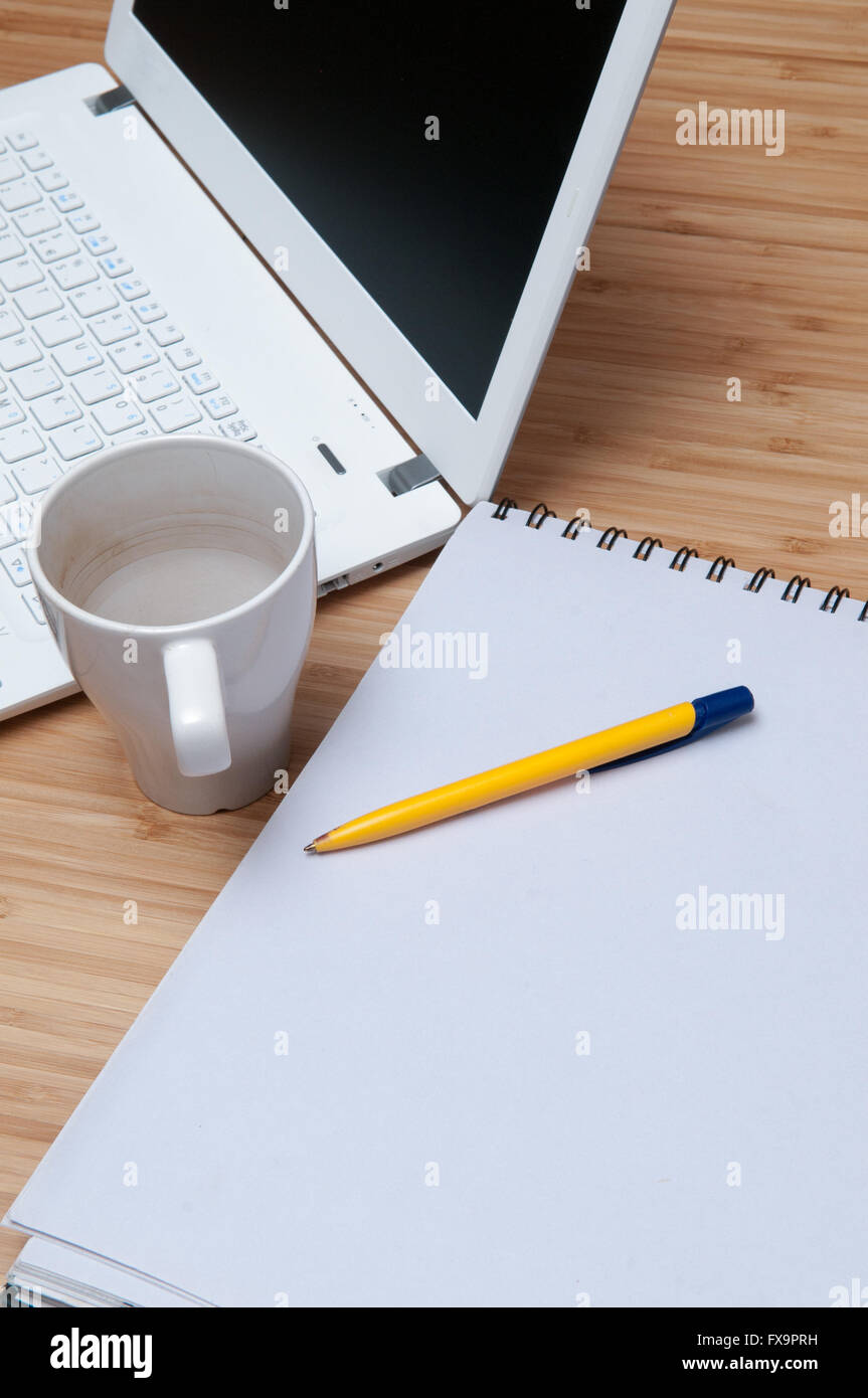 Is Notepad Screen Laptop and notepad on the table with blank screen and pages Stock Photo ...