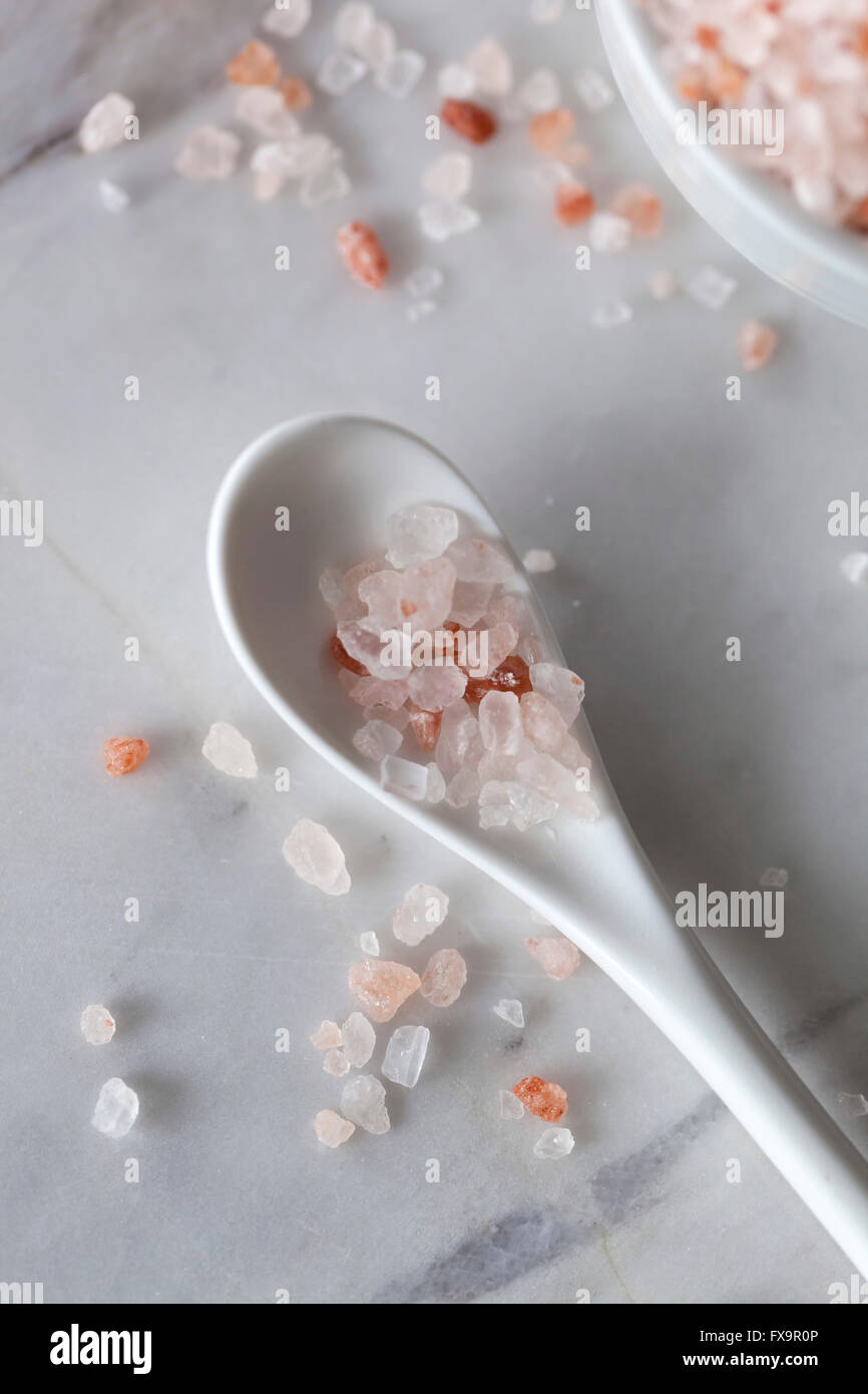 Pink Himalayan salt on the white spoon Stock Photo