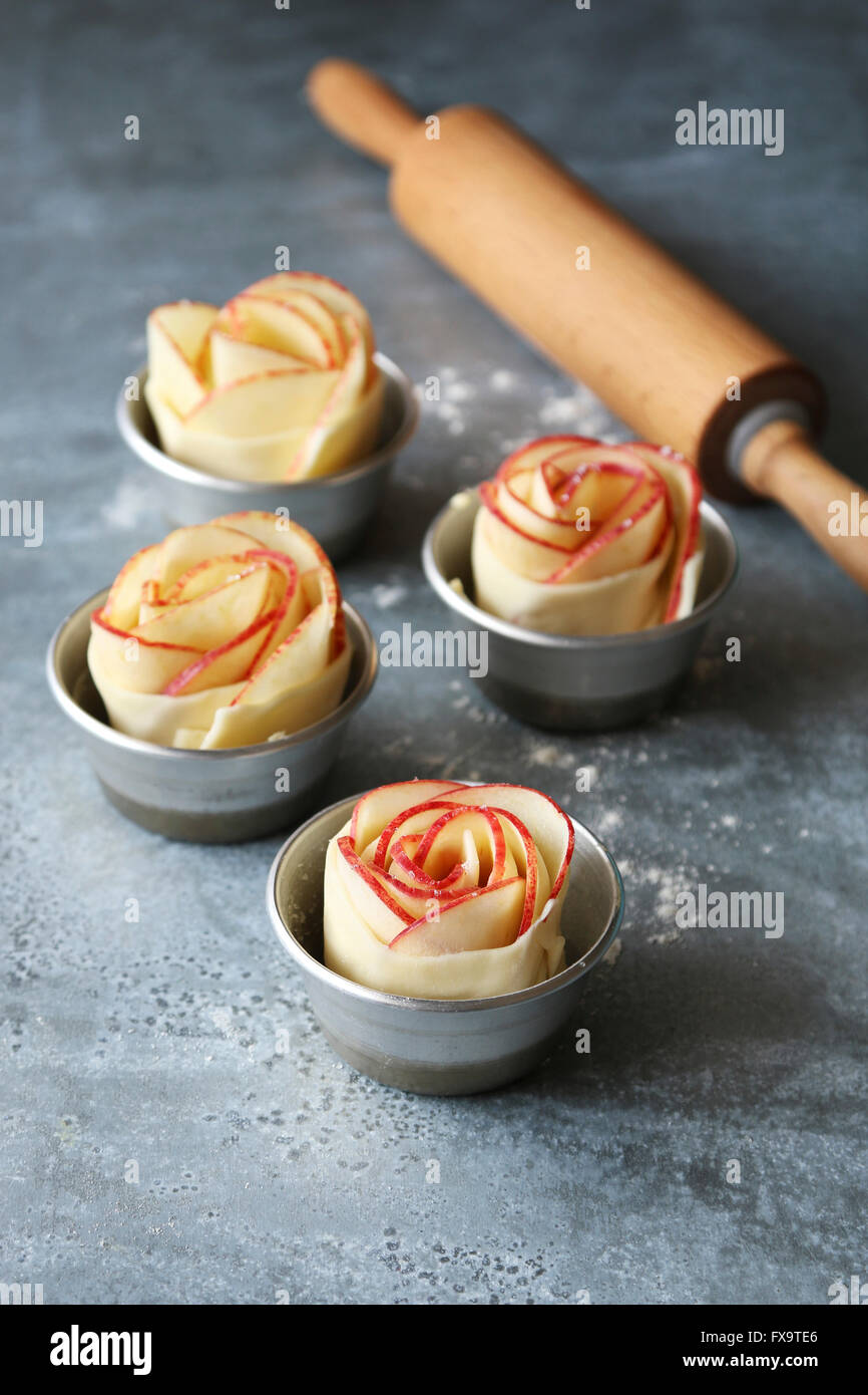 Apple rose pies in aluminium pan before baking Stock Photo Alamy