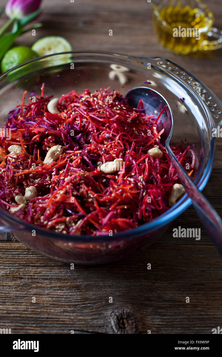 Raw carrot, apple, beetroot and red cabbage salad Stock Photo