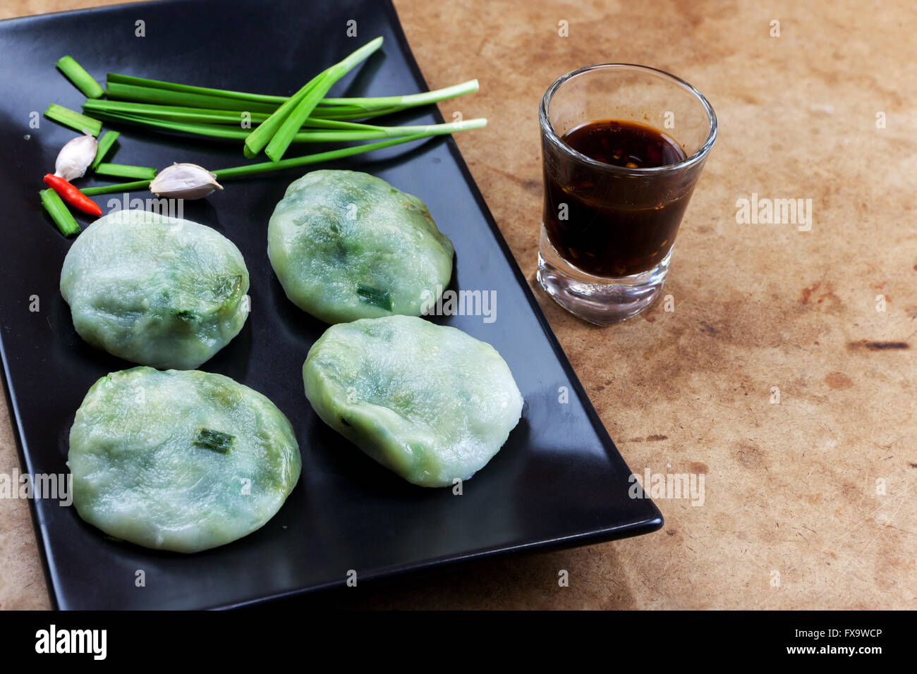Allium tuberosum. Garlic chives with soy source. Dim sum is chinese cuisine. Stock Photo