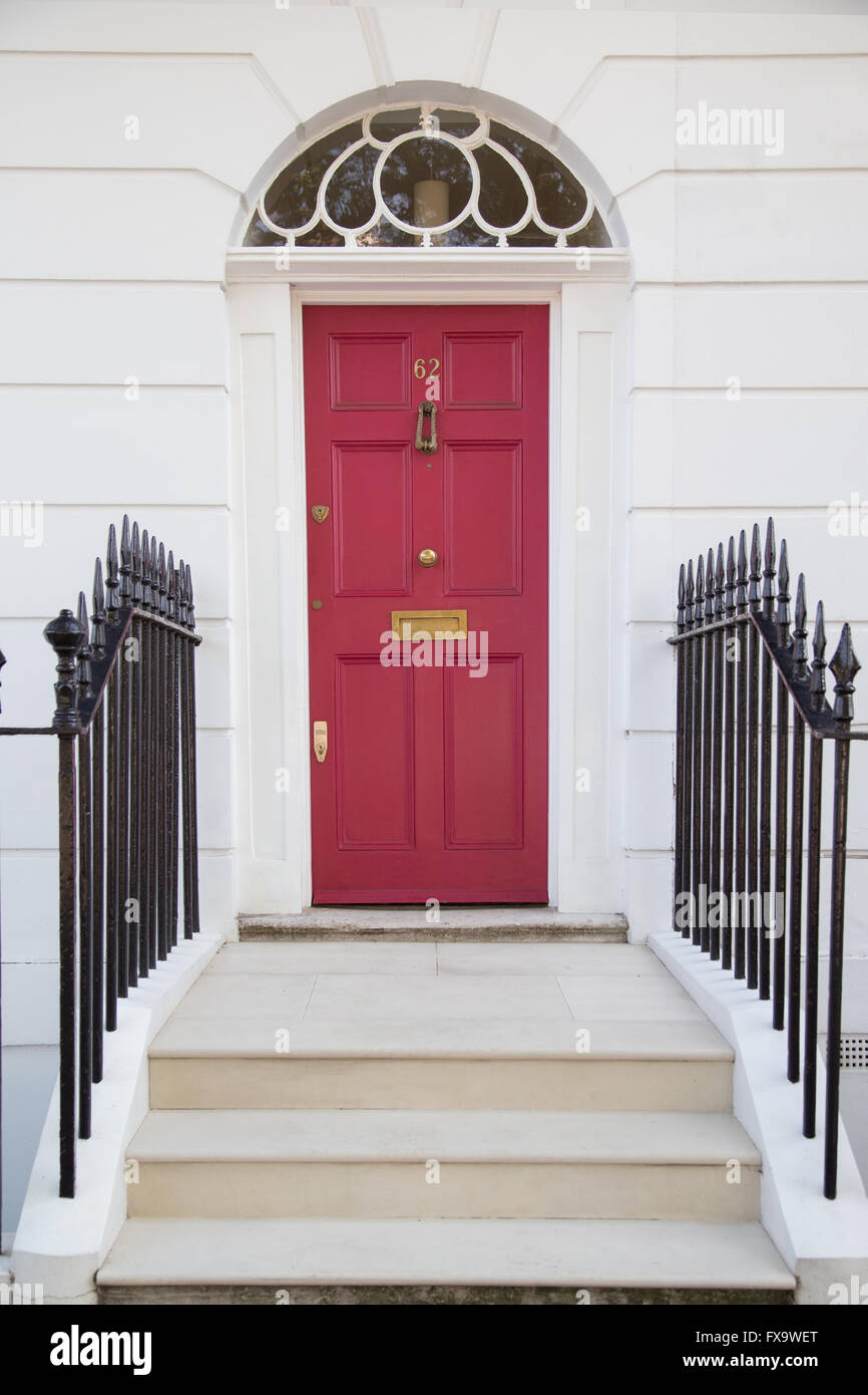 Georgian era six-panel red front door with fanlight in Gibson Square, Islington, north London Stock Photo