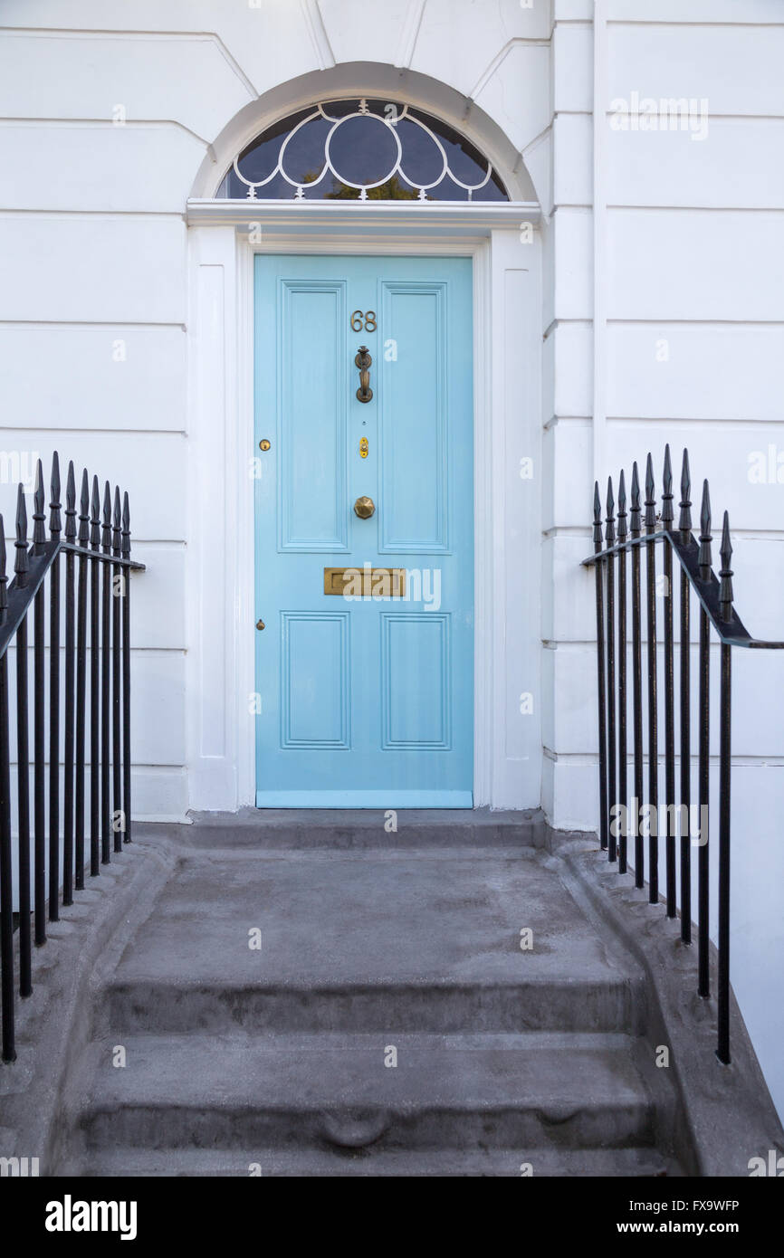 light-blue Georgian era four-panel front door with fanlight in Islington, north London Stock Photo