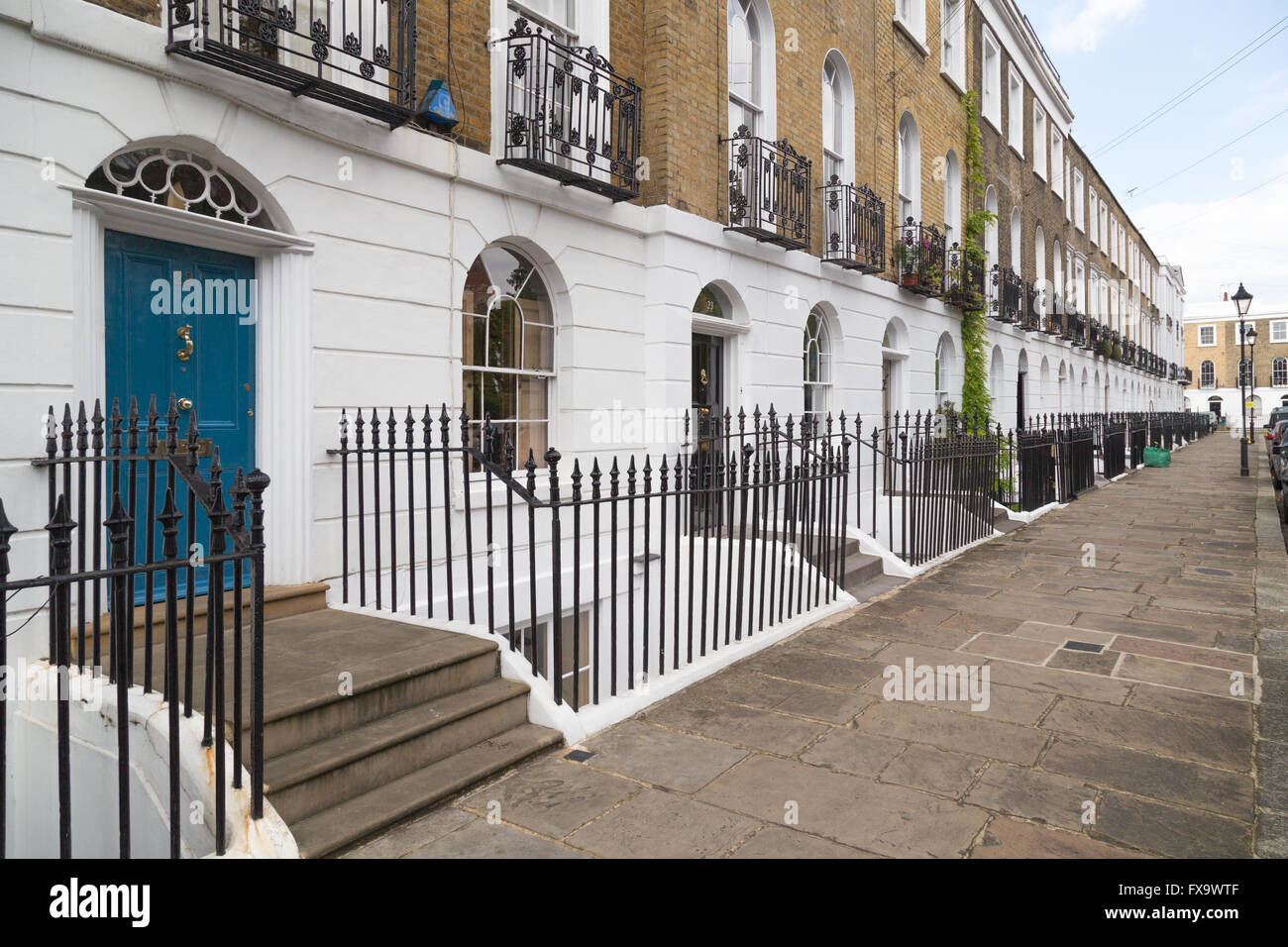 terraced town house facades and railings on Gibson Square
