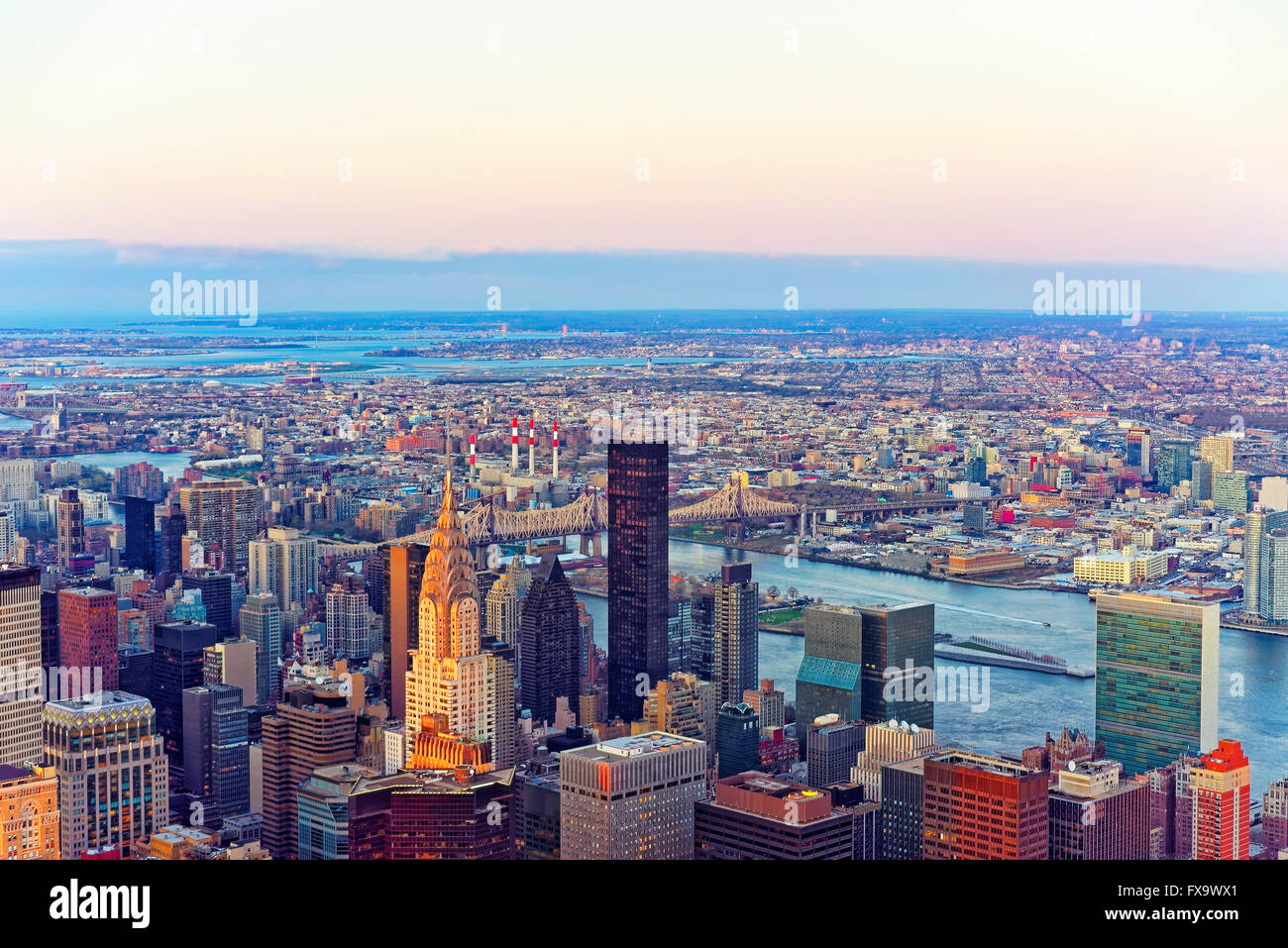 Panoramic view from Observatory deck of the Empire State Building on Midtown district of Manhattan in New York. East river and New York Queensboro Bridge in Long Island City are on the background. Stock Photo