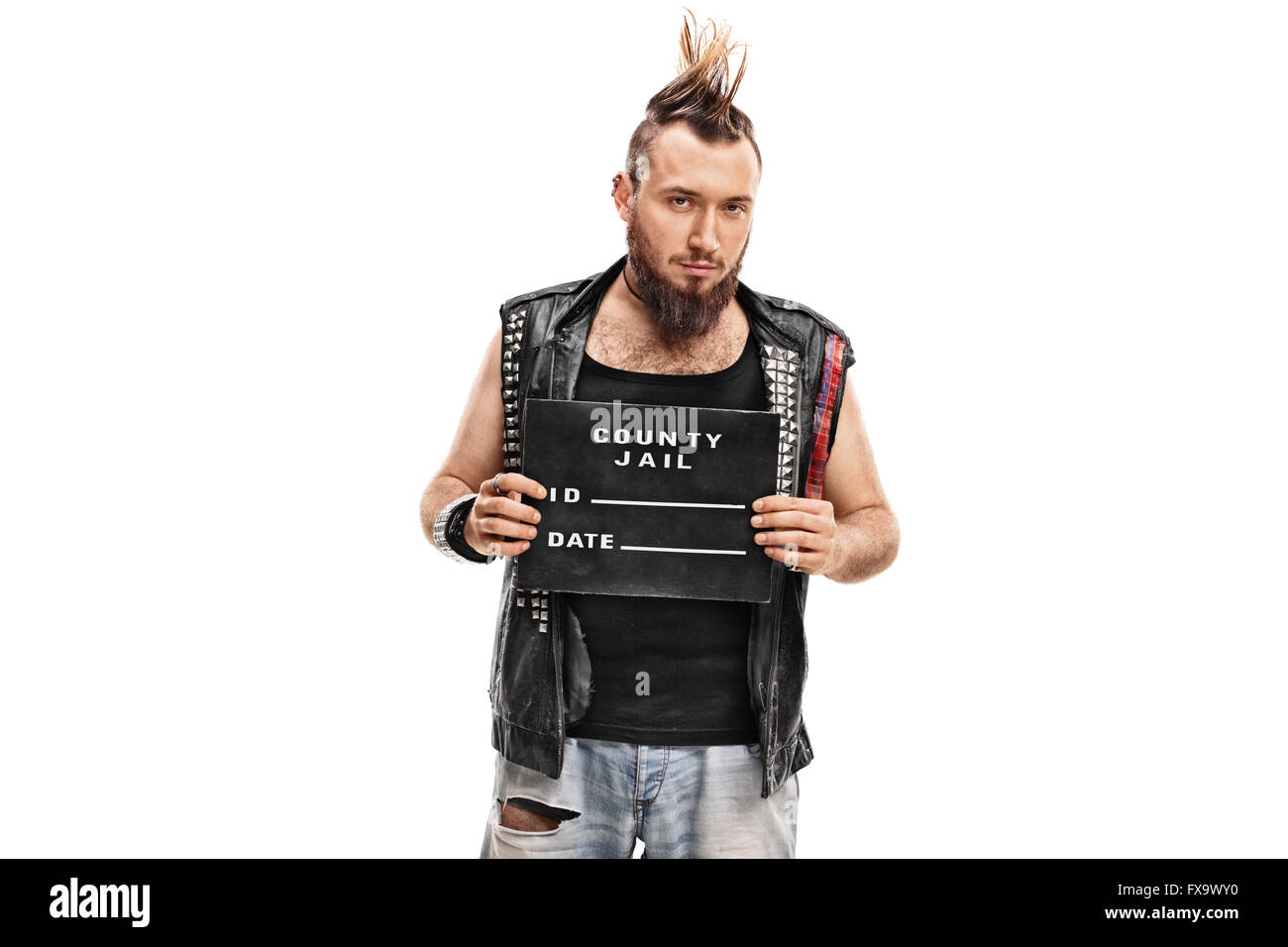 Studio shot of a punk rocker posing for a mug shot with a black plate isolated on white background Stock Photo
