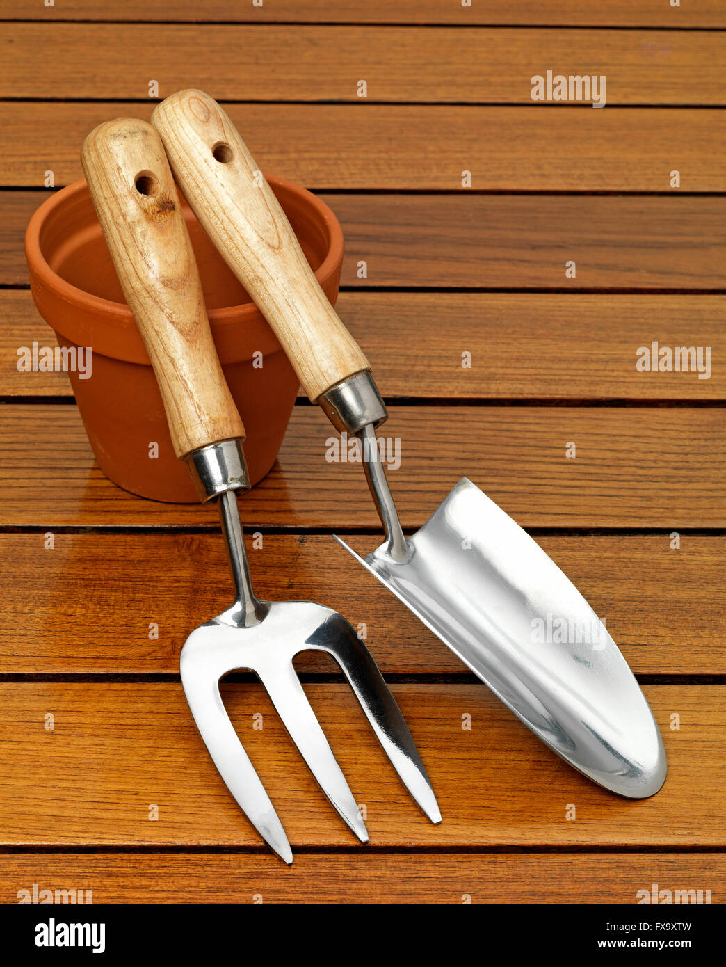 garden trowel and fork on a table top Stock Photo Alamy