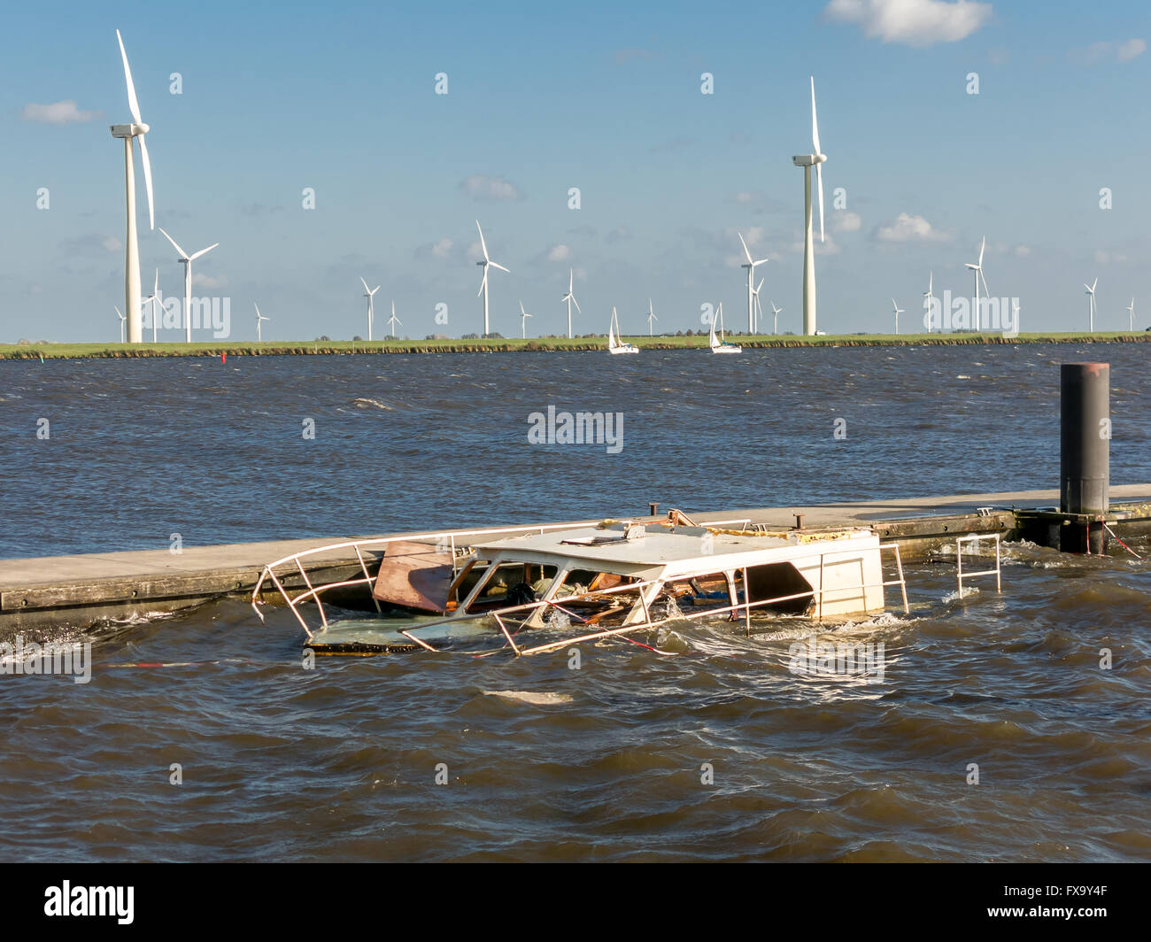 Half sunken motor yacht at jetty, Netherlands Stock Photo