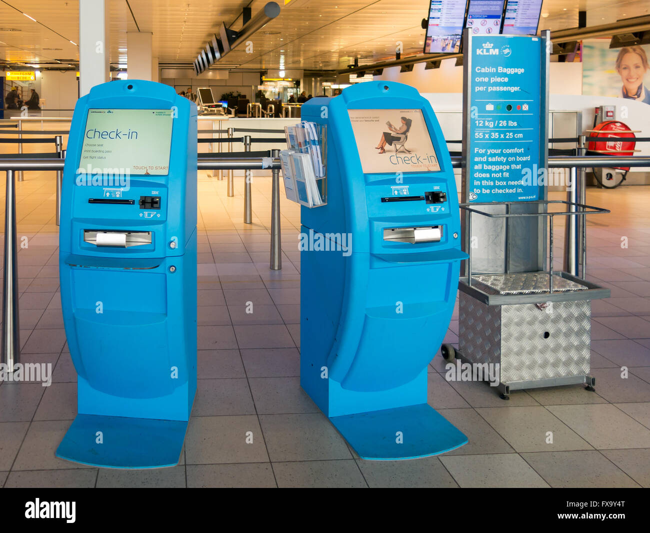 KLM self-service checking in machines at Schiphol Amsterdam Airport in the Netherlands Stock Photo