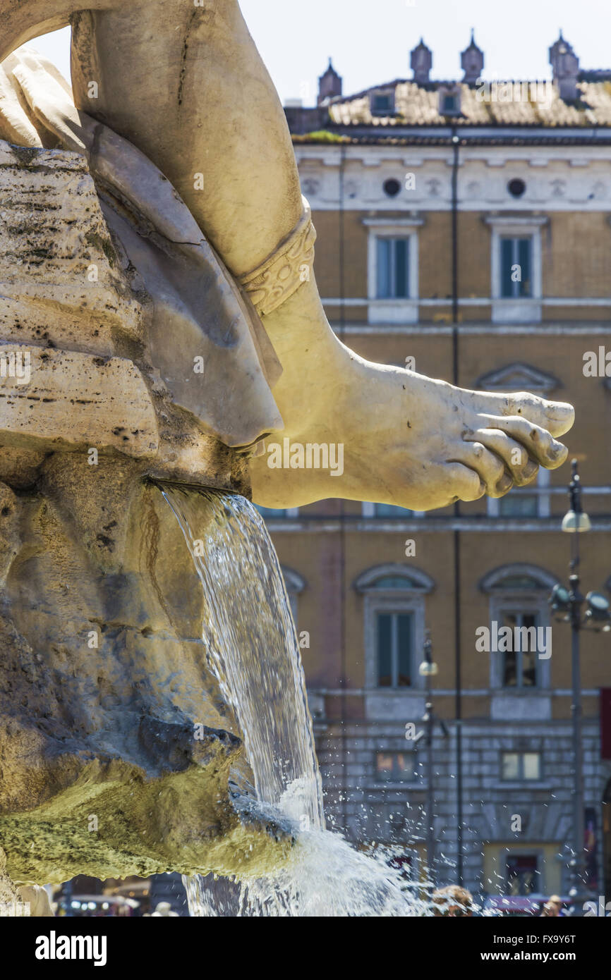 the marble foot of Rio de la Plata statue with gushing water in piazza navona, Rome Stock Photo