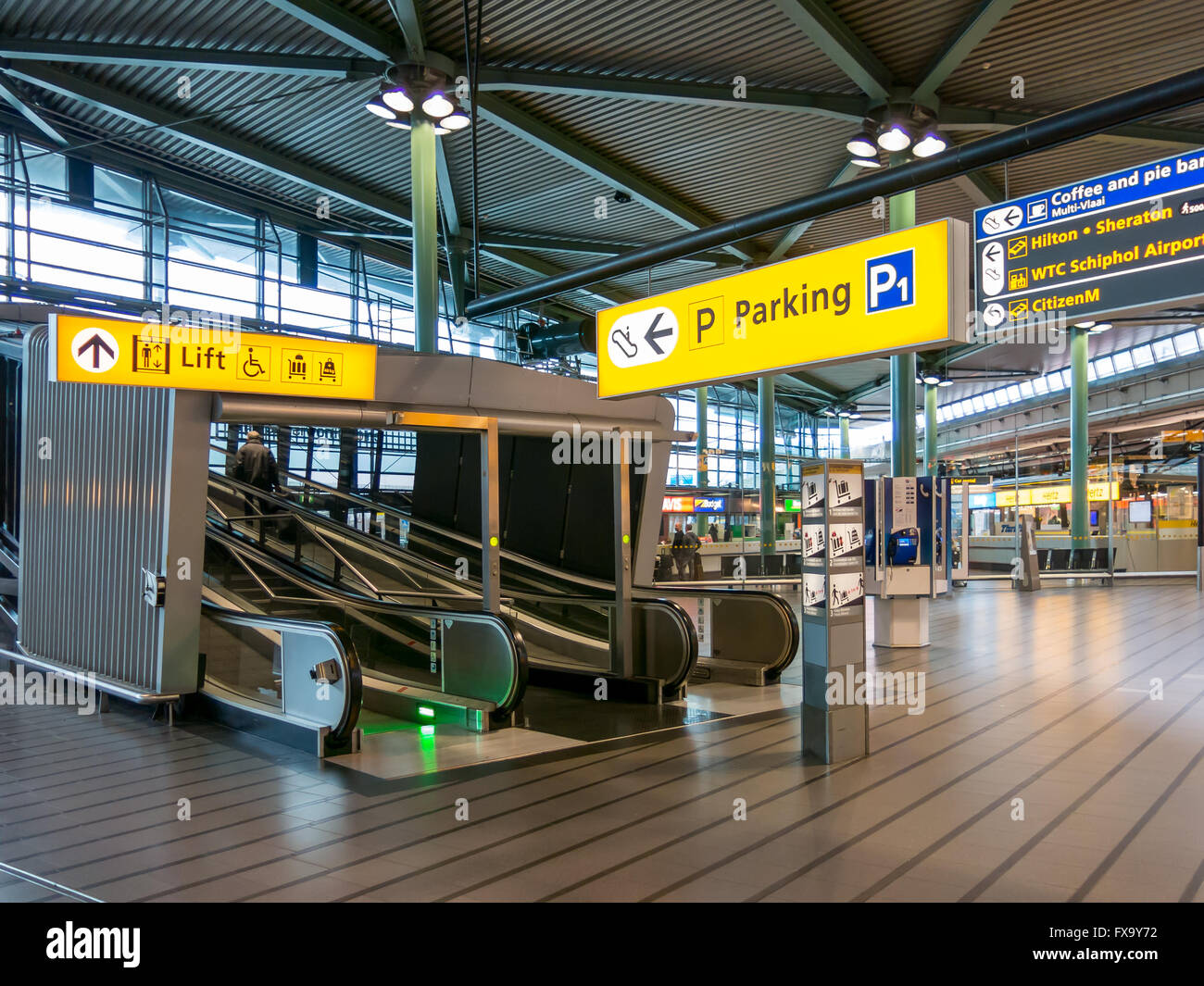 Signs and elevators to parking garage at Schiphol Amsterdam Airport, Netherlands Stock Photo