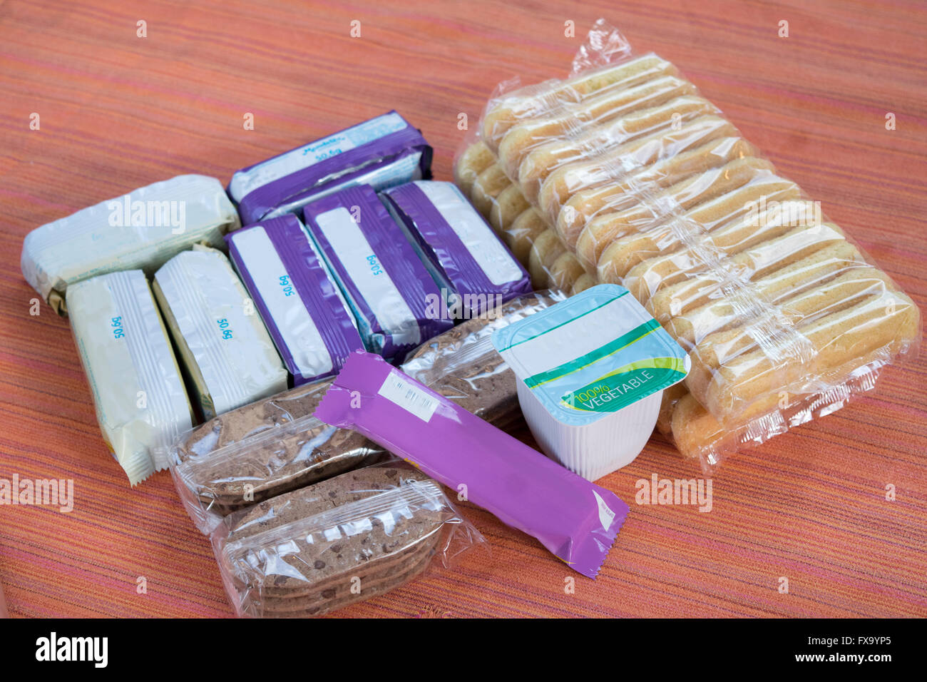 retail packs of snacks biscuits yoghurt pot  and bars in individual packages Stock Photo