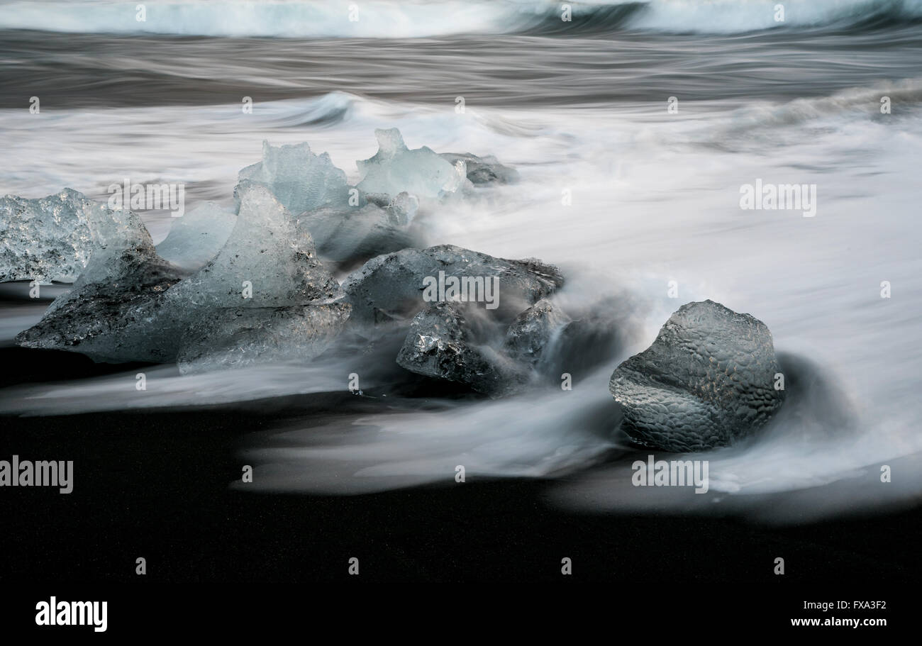 Icebergs from Vatnajokull glacier, drop into Jokulsarlon lake and then to the Ice beach in Iceland. Stock Photo