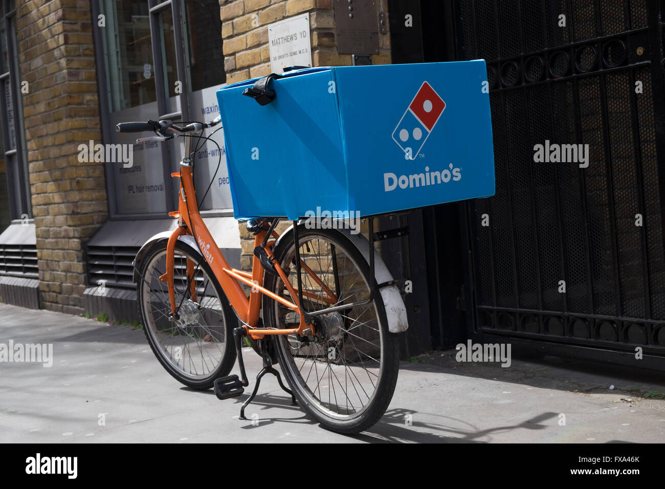 Domino's Pizza delivery bike Stock Photo - Alamy
