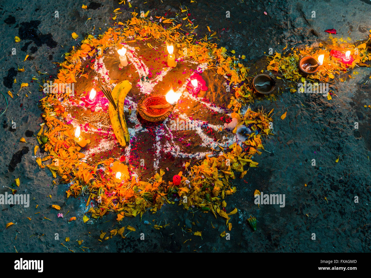 A colorful mandala is made of colorpowder and candles for the Tihar festival, Kathmandu, Nepal Stock Photo