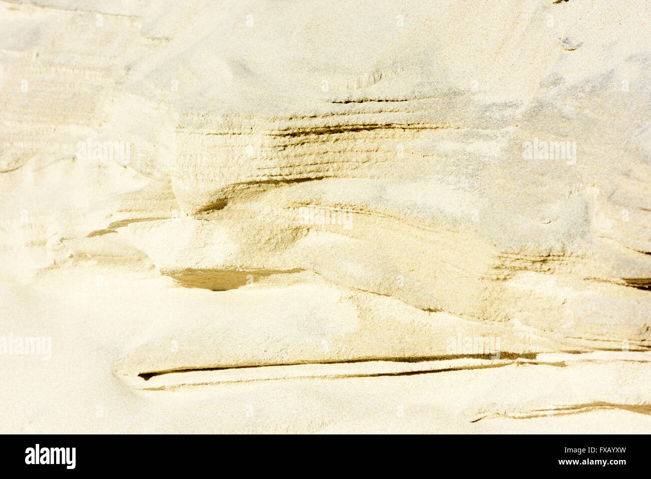 Pattern of layered sand on the side of a sand dune. Stock Photo