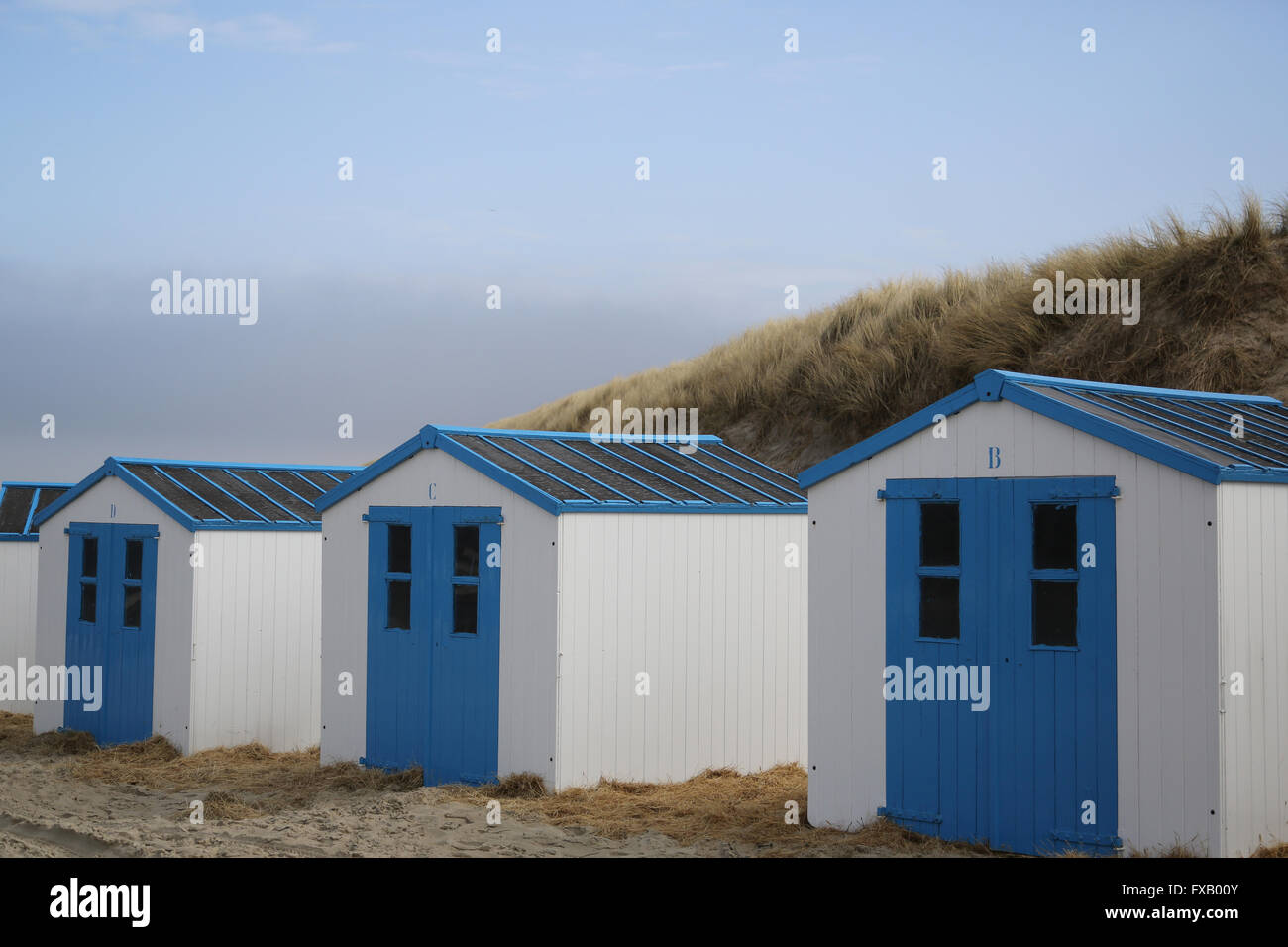 Blue beach houses at the beach in De Koog - Texel - Netherlands Stock Photo