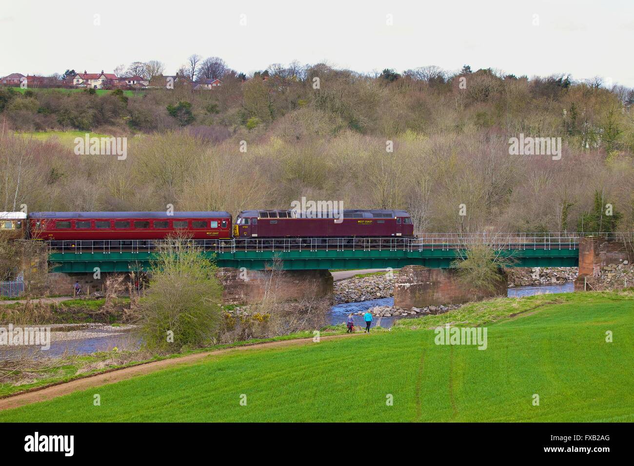 Cummersdale Viaduct. British Rail Class 57, No 57313 run by West Coast Railway Company crossing bridge. Carlisle, Cumbria, UK. Stock Photo