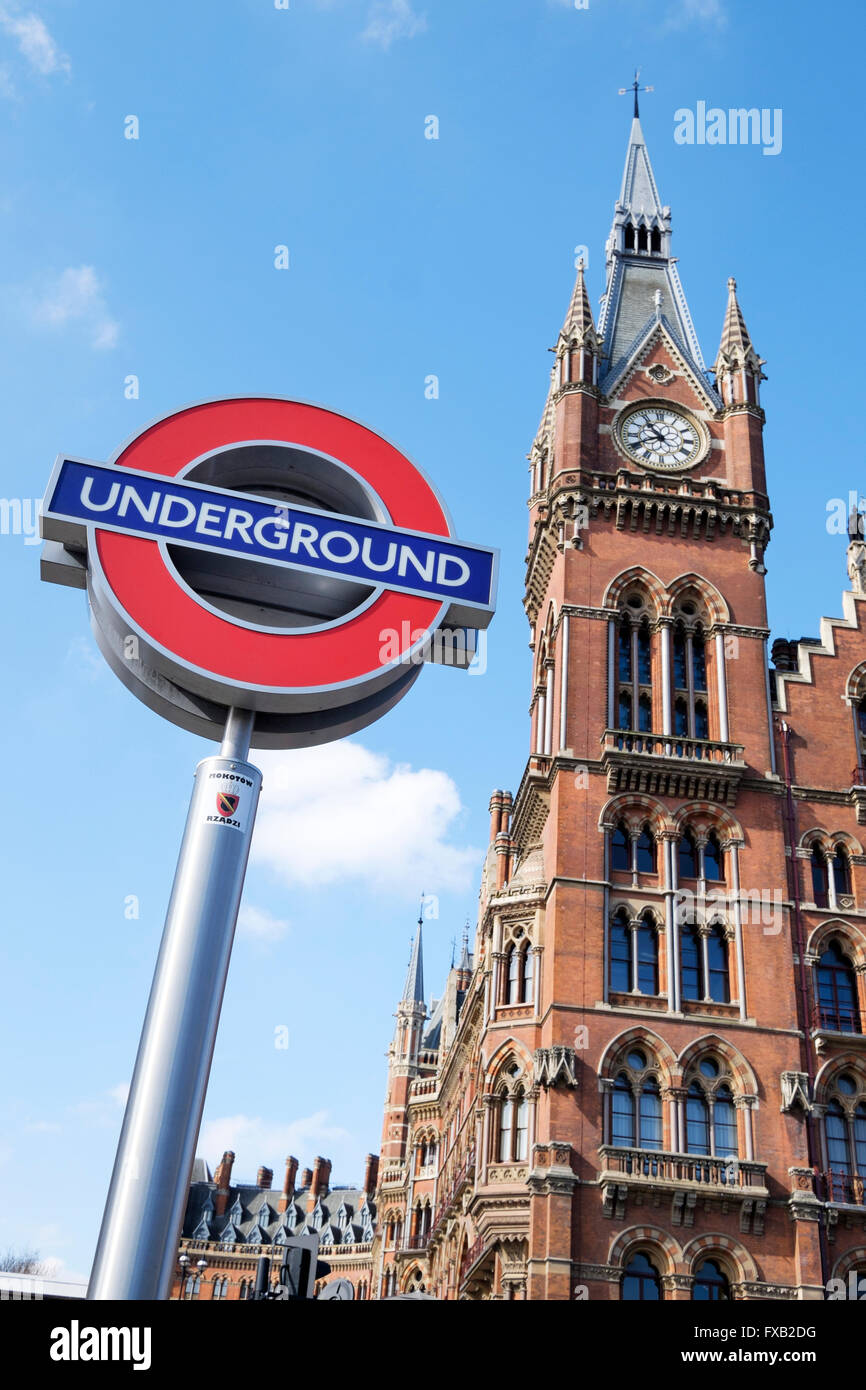 London underground tube sign and the Victorian clock tower of St Pancras station, London, England, UK Stock Photo