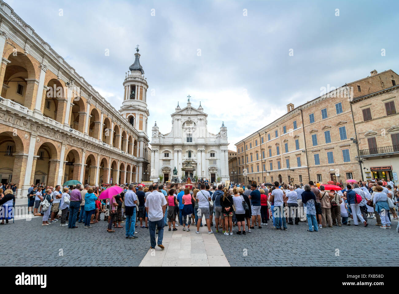tourists and pilgrims in front of famous Shrine of the Holy House church in Loreto, Italy. Stock Photo
