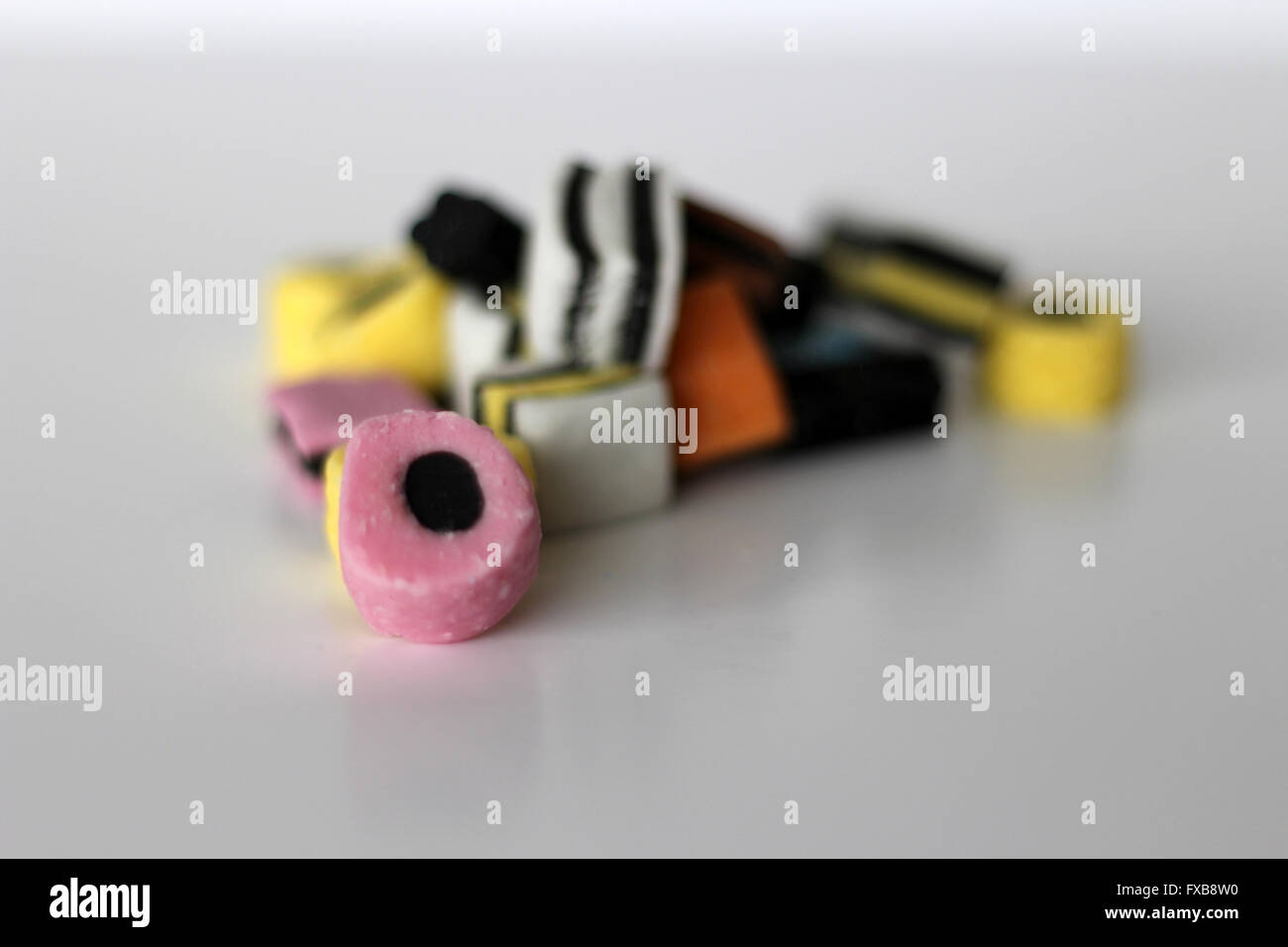 Liquorice Allsorts displayed on a white background Stock Photo - Alamy