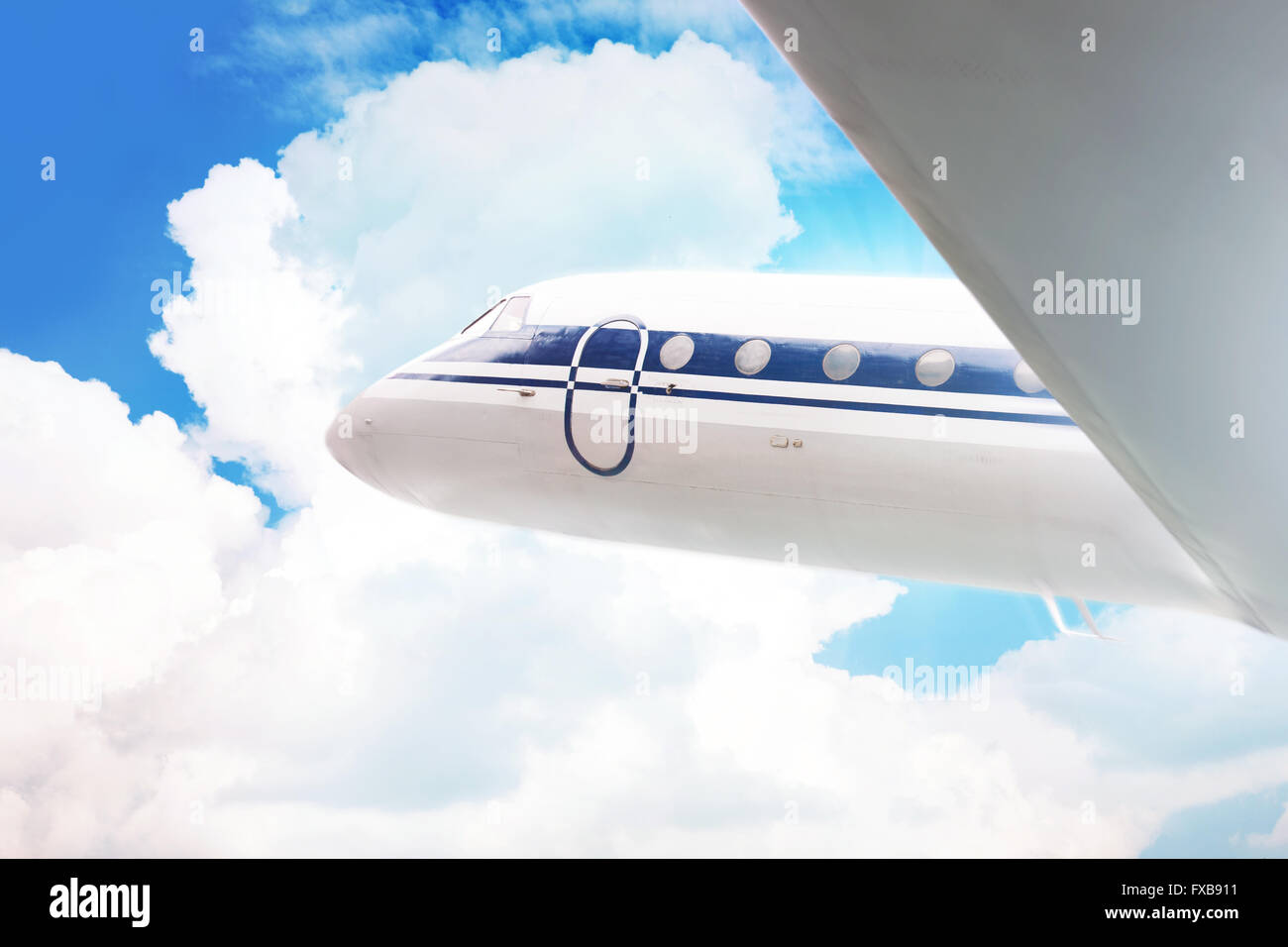 Passenger plane in the sky on the cloud background Stock Photo - Alamy