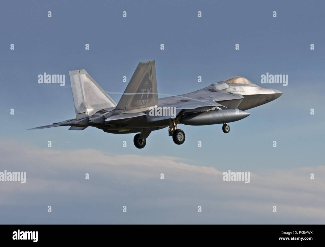Tyndall AFB based USAF F-22 Raptor landing at RAF Lakenheath, England Stock Photo